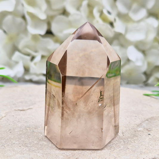 Polished natural Smoky Quartz point from Brazil with grounding energy. Ideal for emotional release, protection, and meditation.