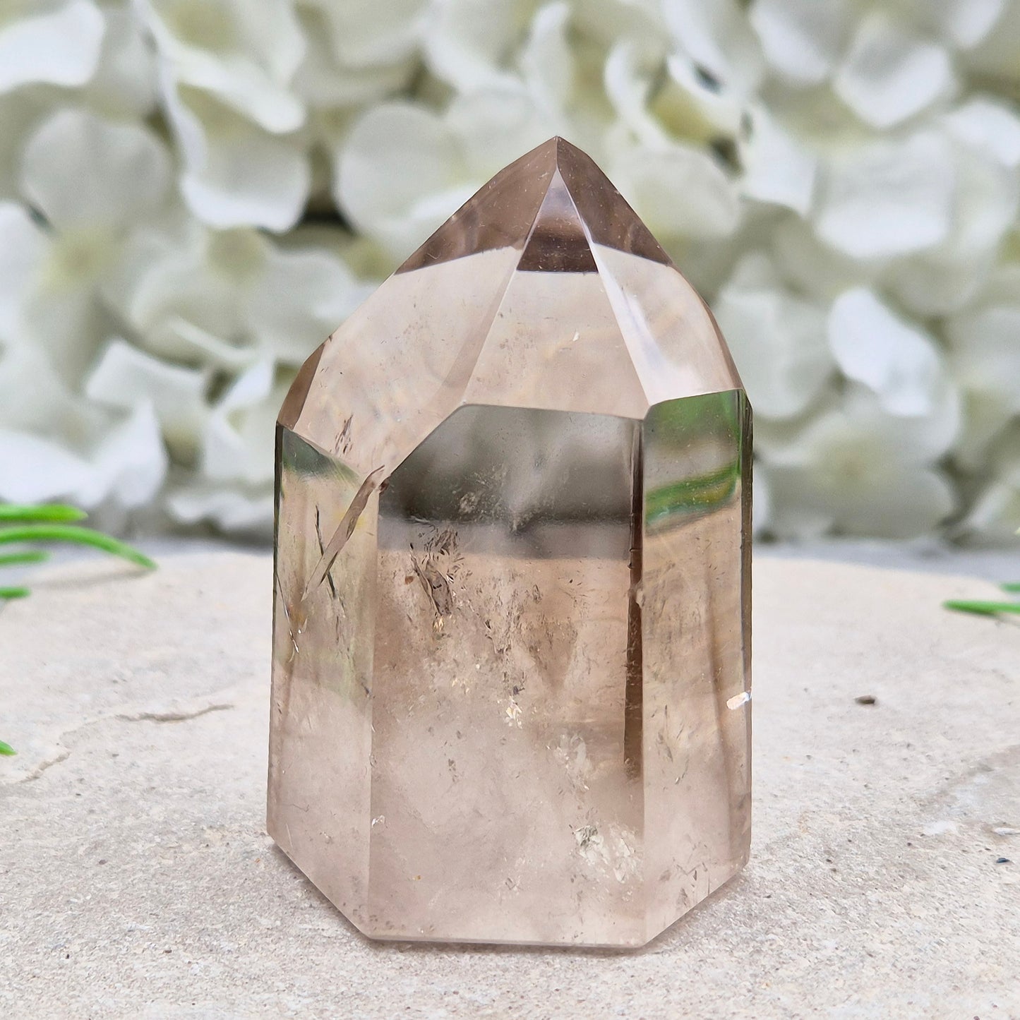 Polished natural Smoky Quartz point from Brazil with grounding energy. Ideal for emotional release, protection, and meditation.