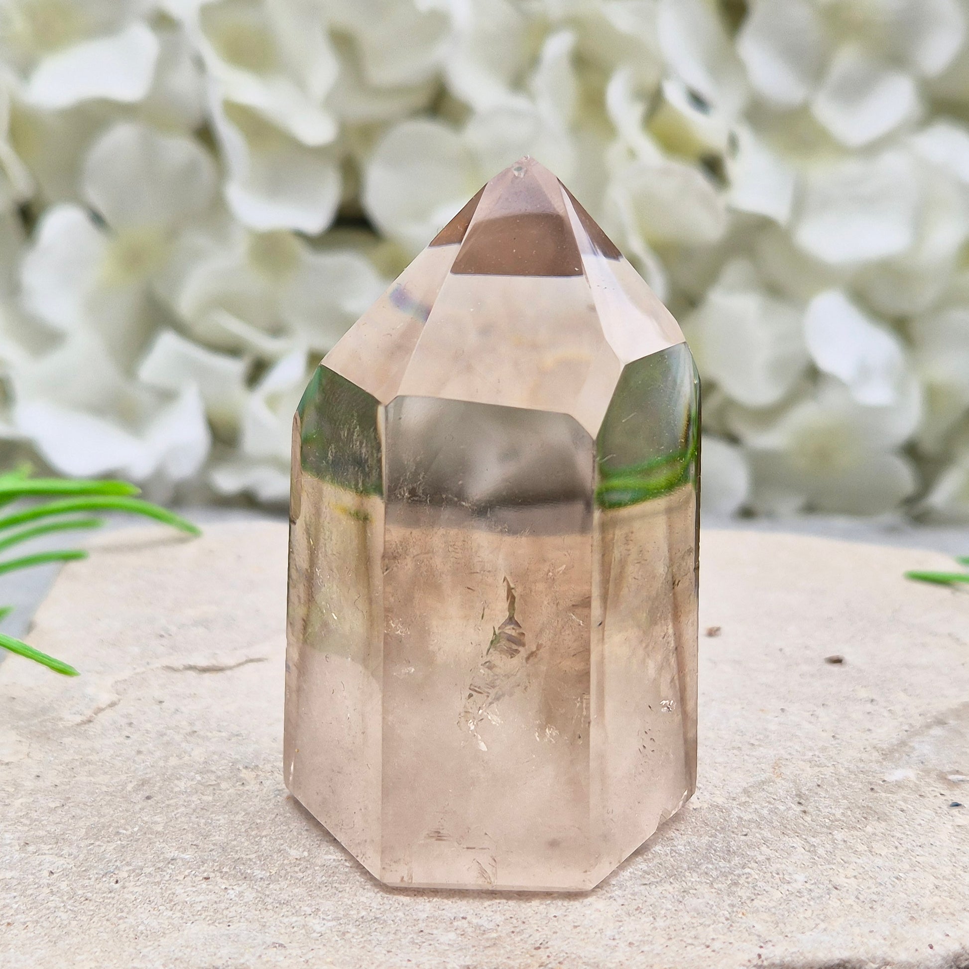 Polished natural Smoky Quartz point from Brazil with grounding energy. Ideal for emotional release, protection, and meditation.