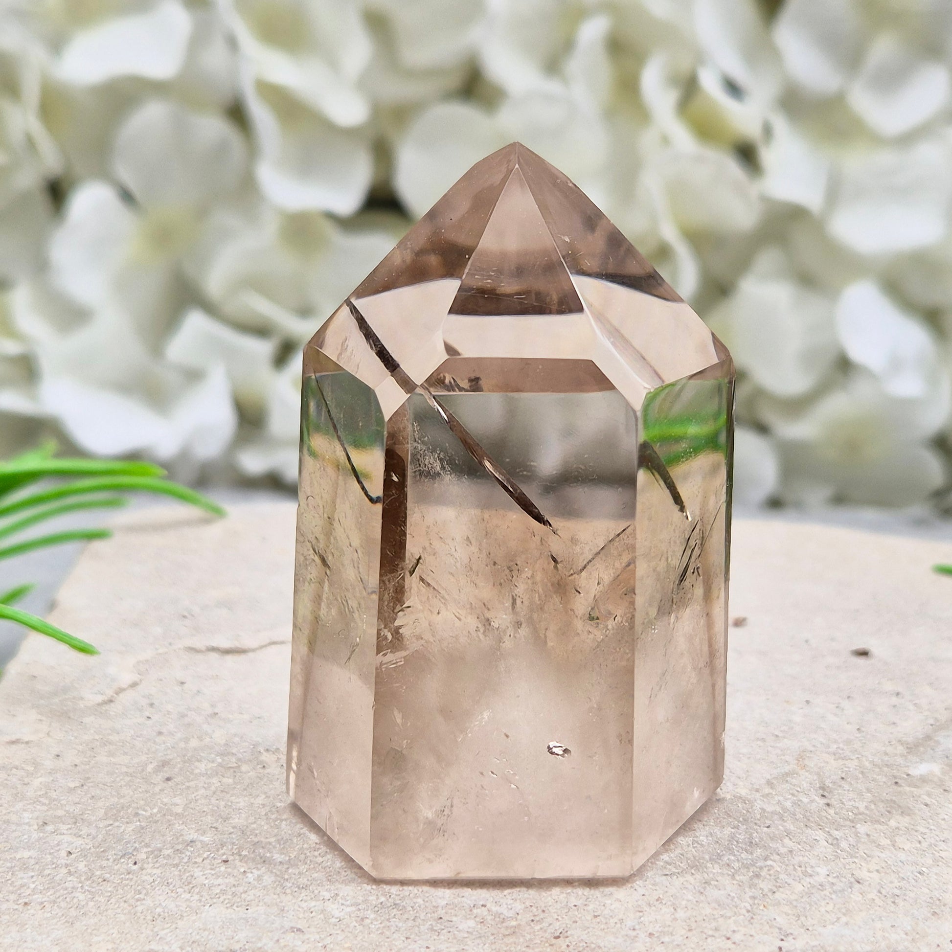 Polished natural Smoky Quartz point from Brazil with grounding energy. Ideal for emotional release, protection, and meditation.