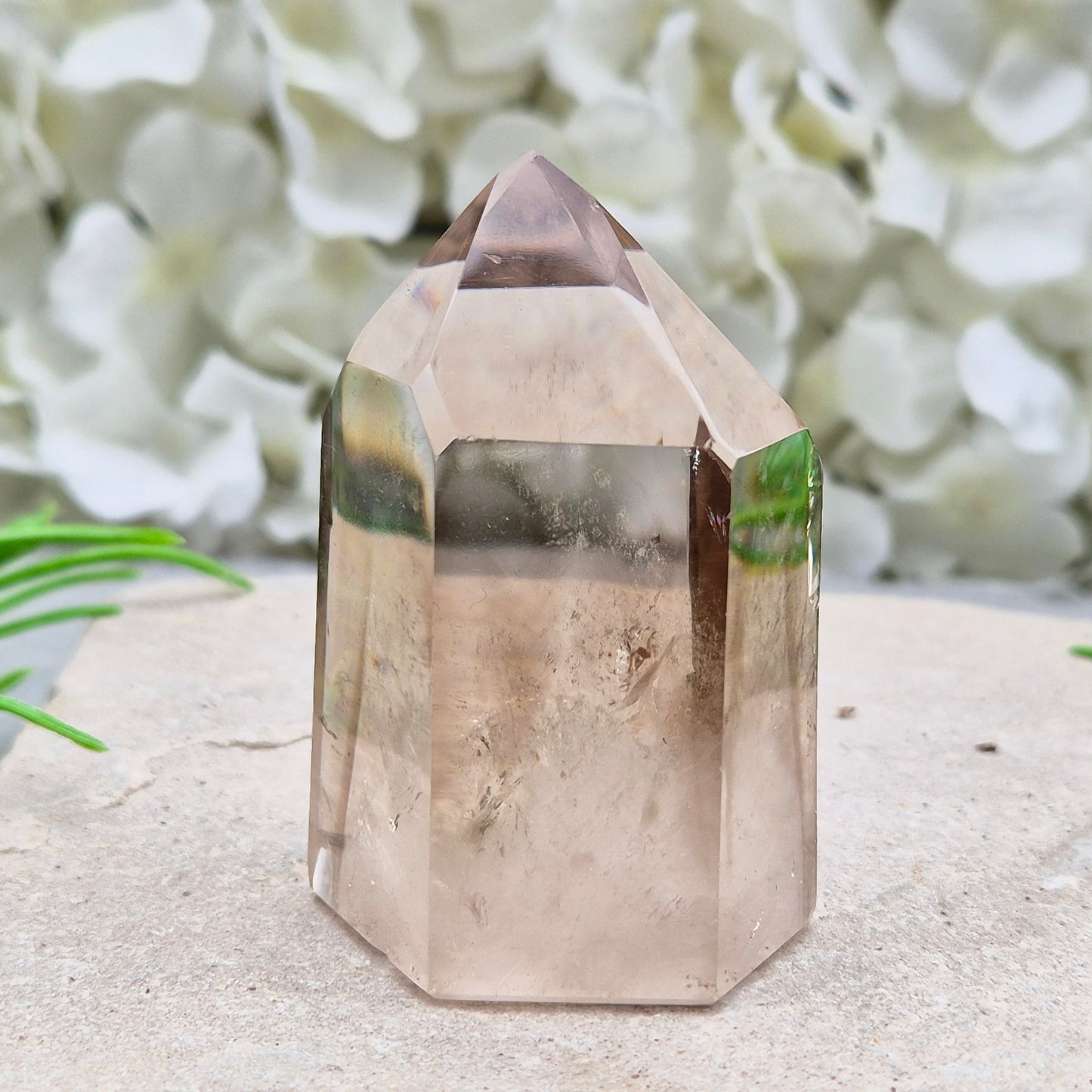 Polished natural Smoky Quartz point from Brazil with grounding energy. Ideal for emotional release, protection, and meditation.