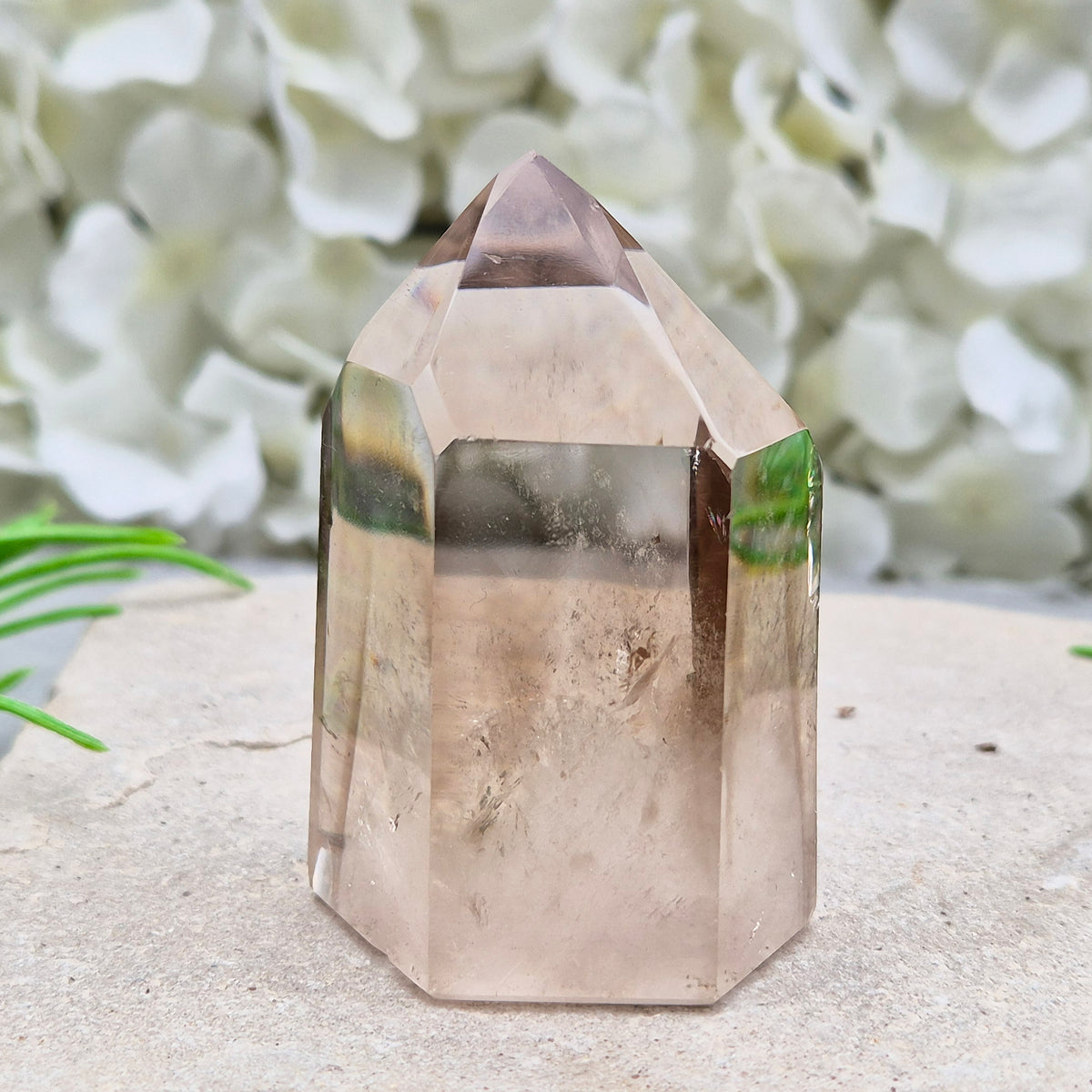 Polished natural Smoky Quartz point from Brazil with grounding energy. Ideal for emotional release, protection, and meditation.