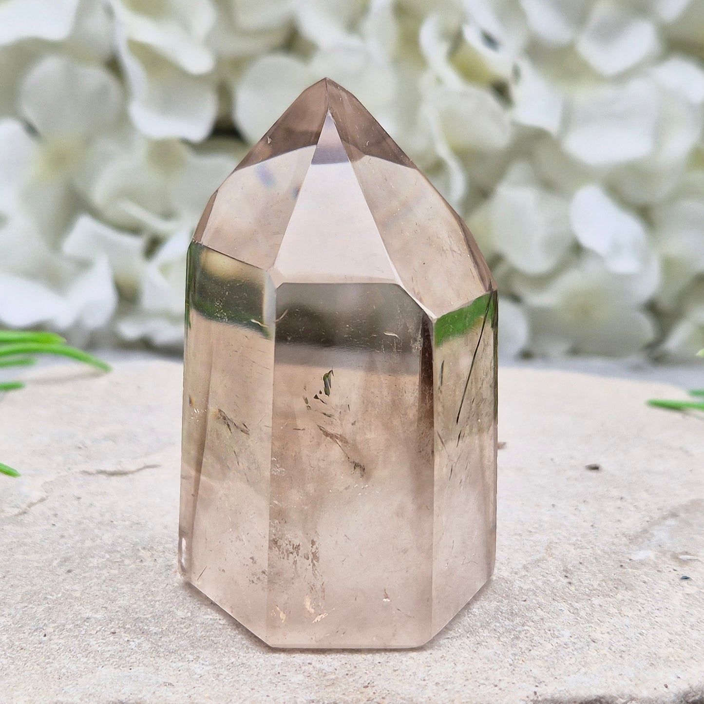 Polished natural Smoky Quartz point from Brazil with grounding energy. Ideal for emotional release, protection, and meditation.