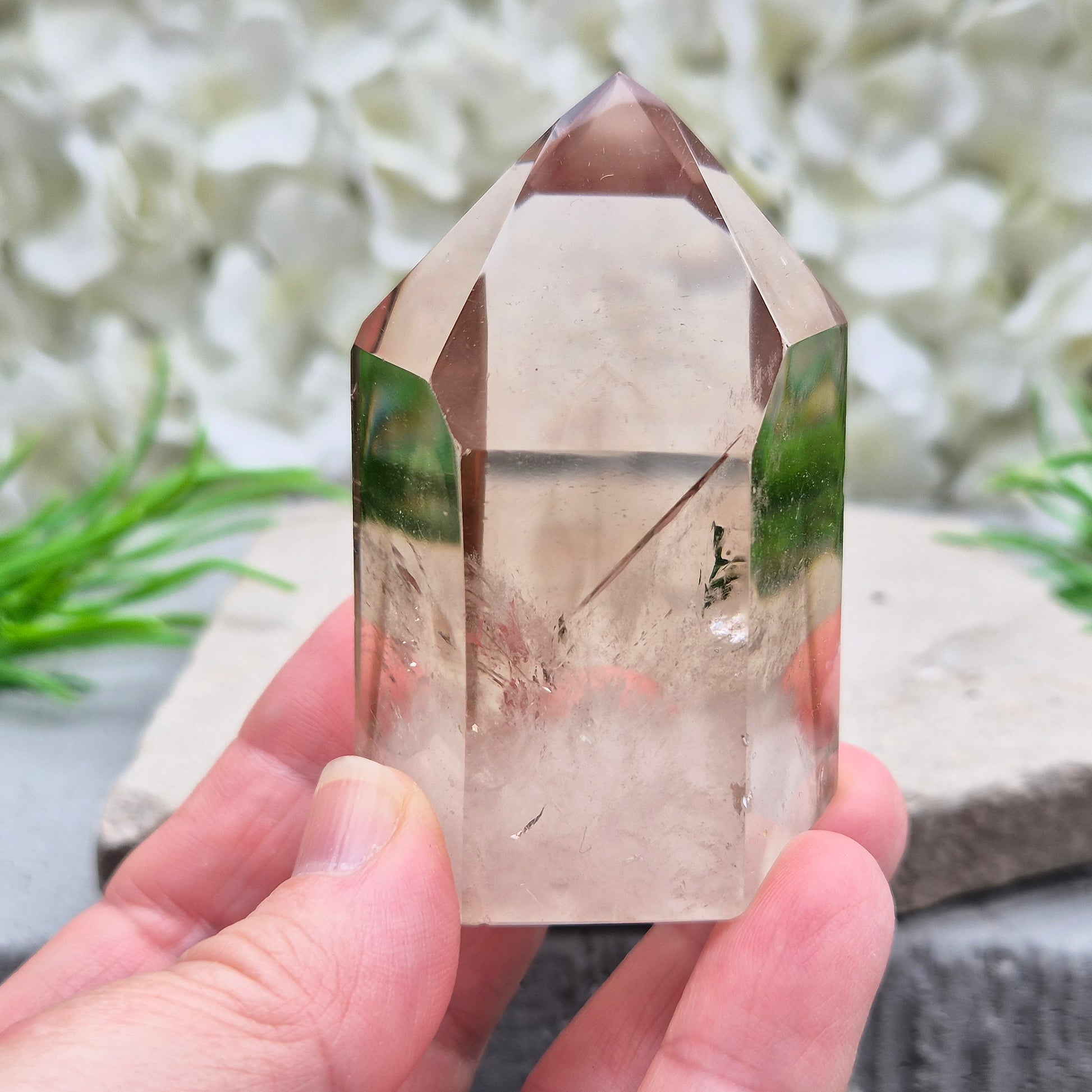 Polished natural Smoky Quartz point from Brazil with grounding energy. Ideal for emotional release, protection, and meditation.