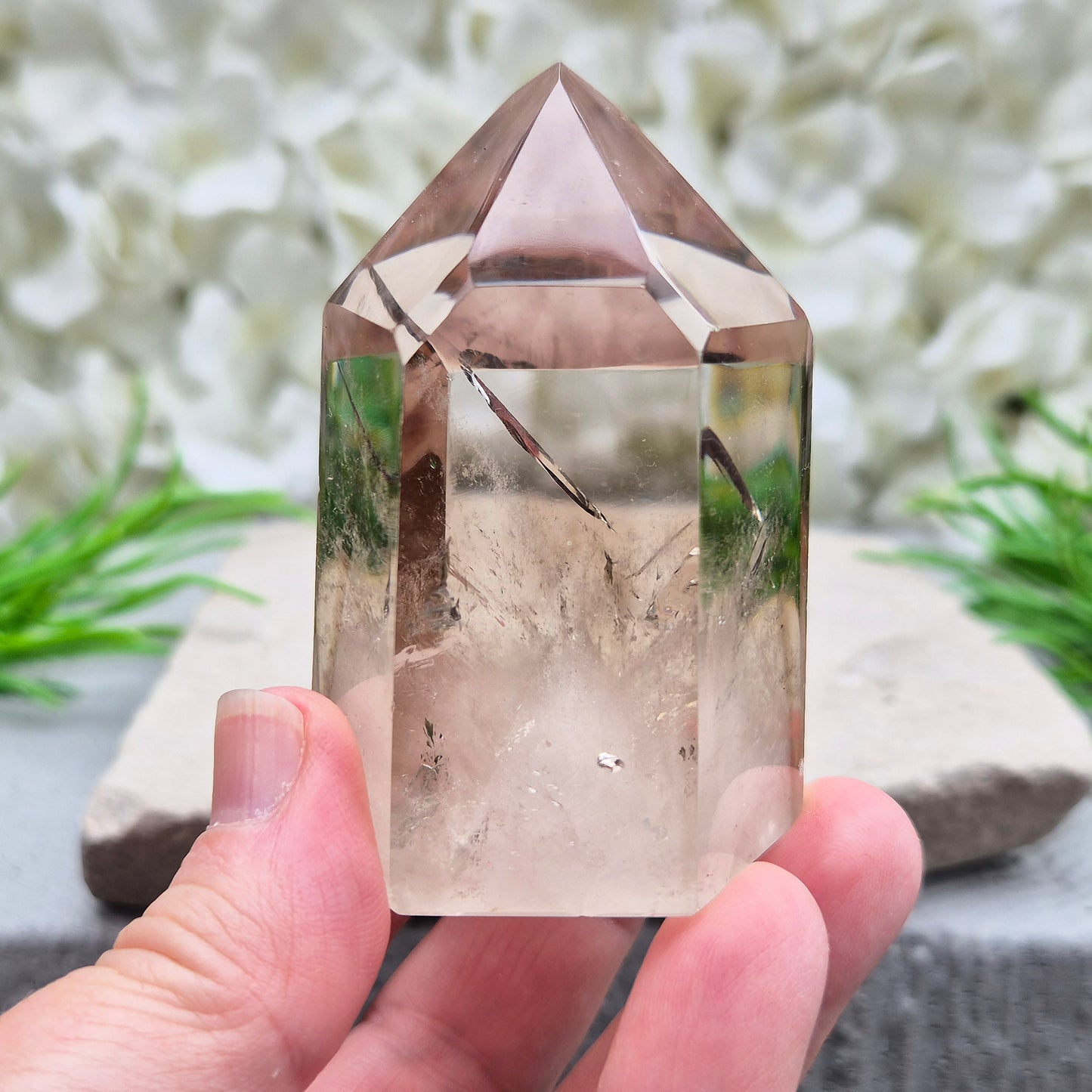 Polished natural Smoky Quartz point from Brazil with grounding energy. Ideal for emotional release, protection, and meditation.
