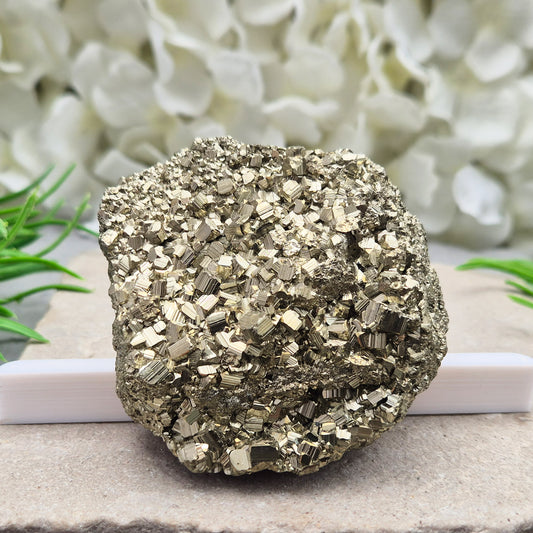 Pyrite cluster with natural cubic crystals and bright metallic shine. Sparkling druzy texture, ideal for display, grounding energy, or crystal collections.