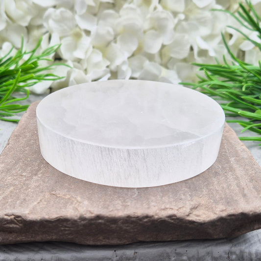 Polished Selenite charging plate that clears heavy energy and recharges your crystals. Ideal for daily cleansing.
