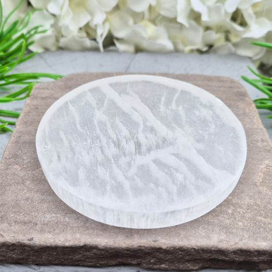 Selenite Round Charging Plate from Morocco. Perfect for cleansing and recharging crystals, jewellery, and small crystal collections.