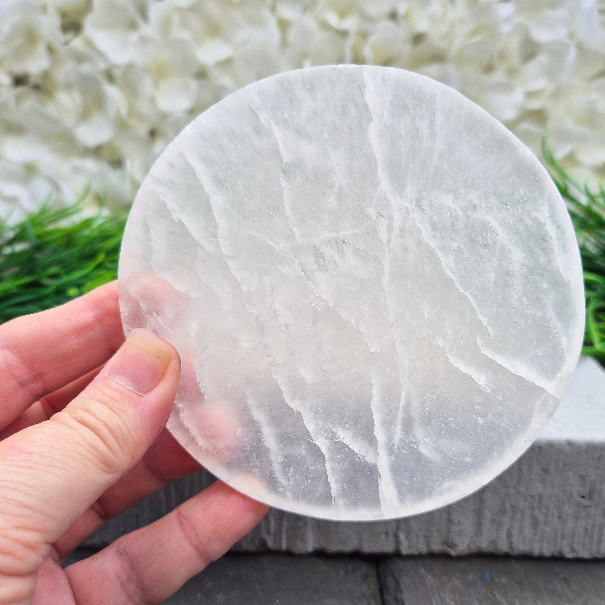 Selenite Round Charging Plate from Morocco. Perfect for cleansing and recharging crystals, jewellery, and small crystal collections.