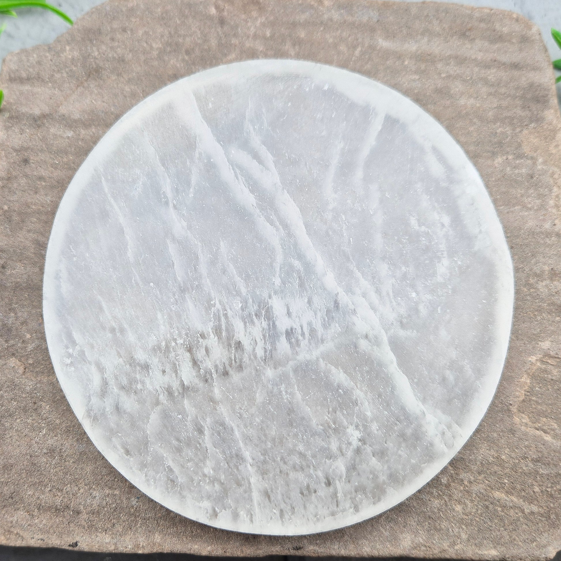Selenite Round Charging Plate from Morocco. Perfect for cleansing and recharging crystals, jewellery, and small crystal collections.