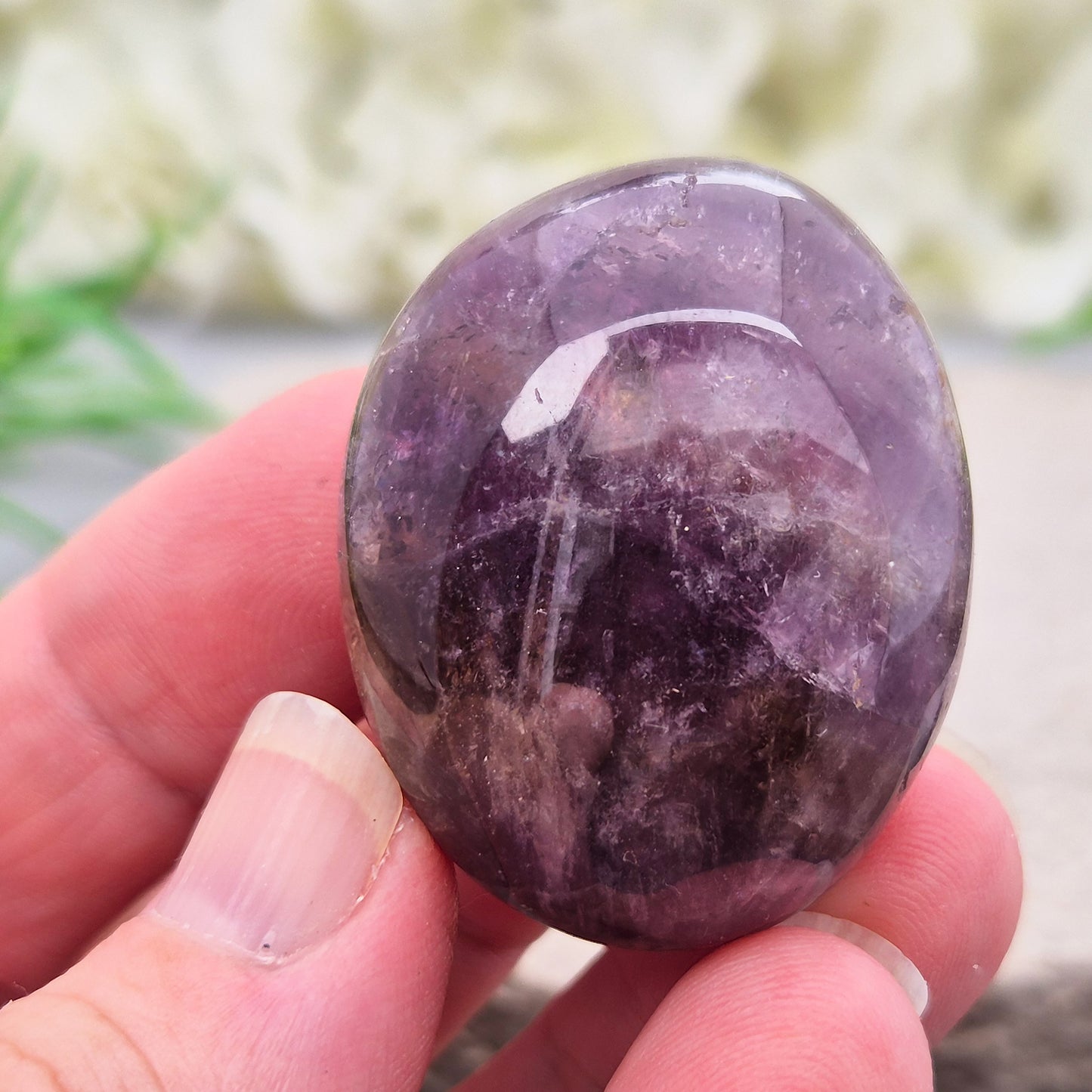 Ametrine polished palm stone with soft purple and golden tones. A natural blend of Amethyst and Citrine with a balanced, easy feel. 