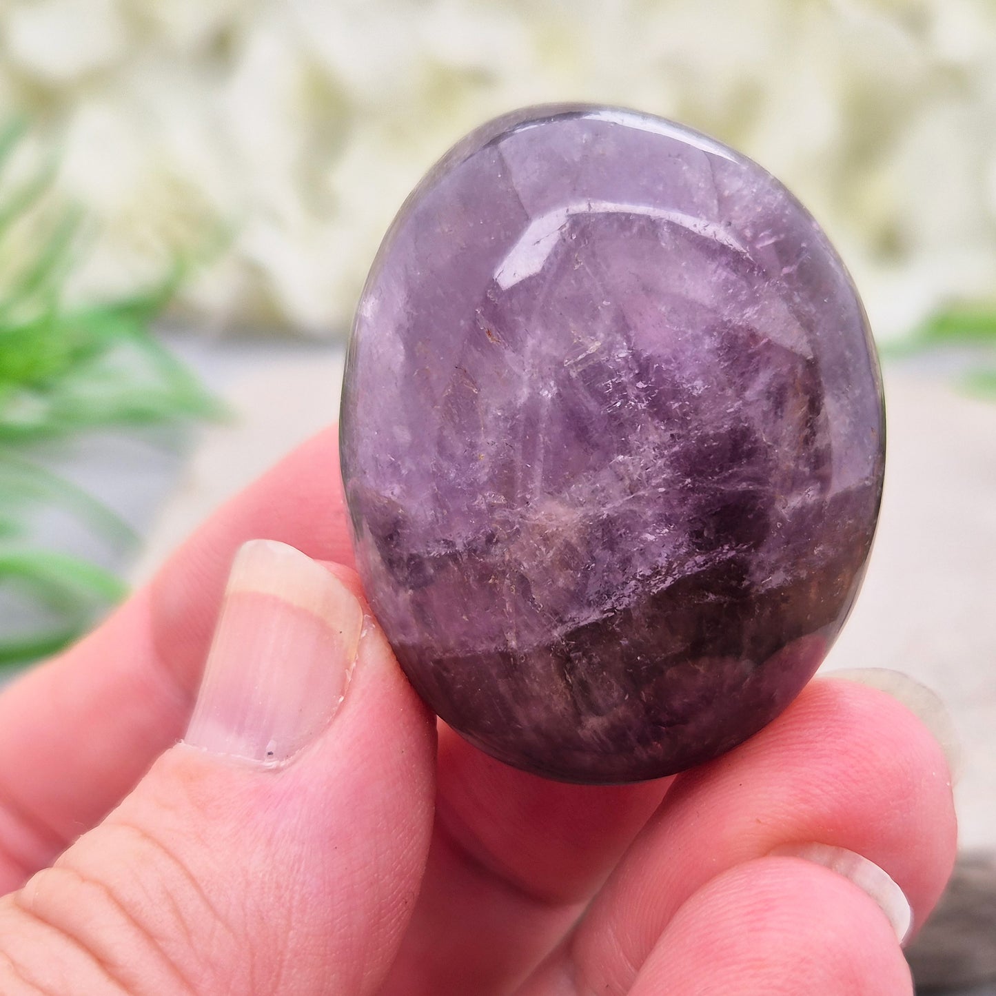 Ametrine polished palm stone with soft purple and golden tones. A natural blend of Amethyst and Citrine with a balanced, easy feel. 