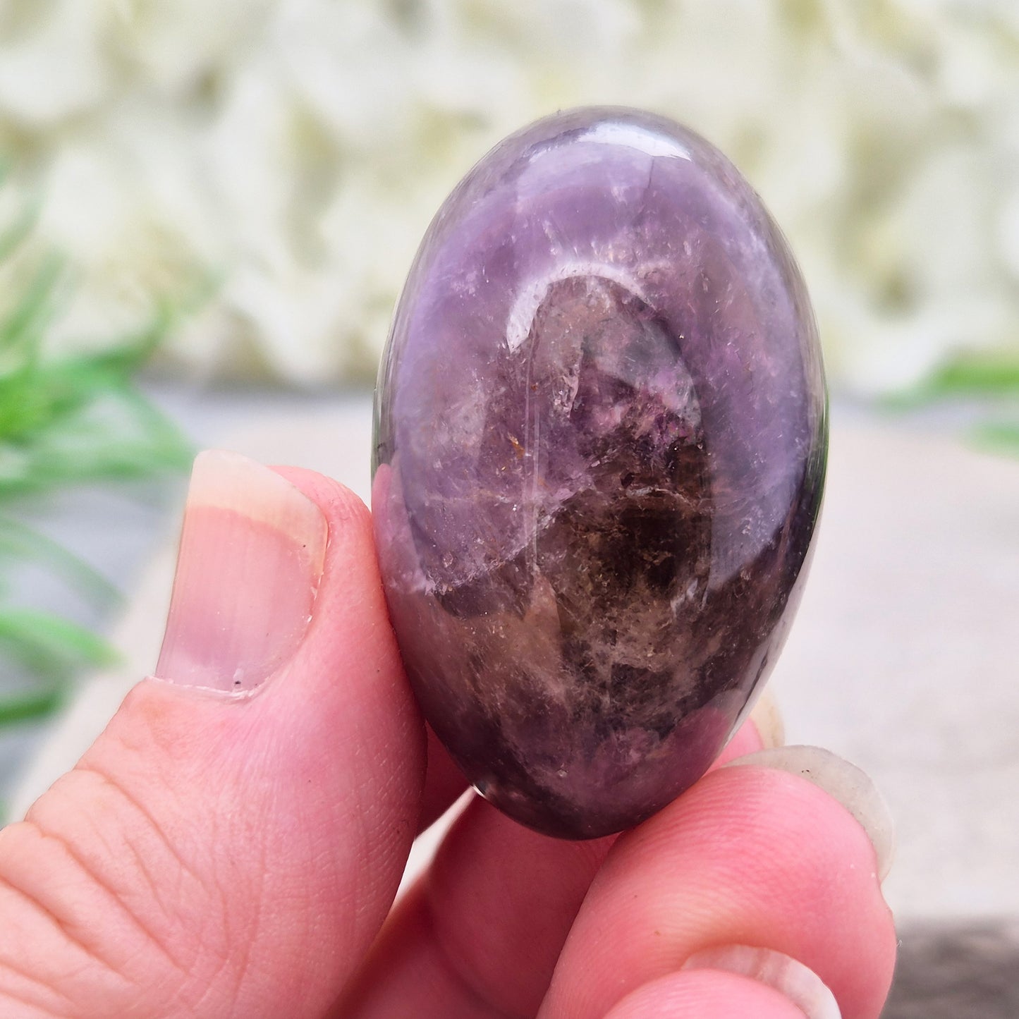 Ametrine polished palm stone with soft purple and golden tones. A natural blend of Amethyst and Citrine with a balanced, easy feel. 