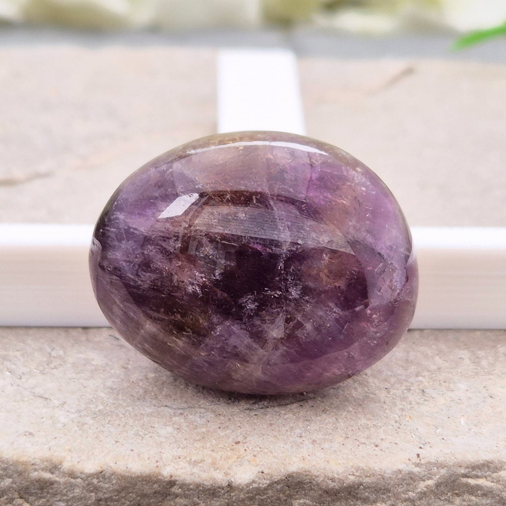 Ametrine polished palm stone with soft purple and golden tones. A natural blend of Amethyst and Citrine with a balanced, easy feel. 