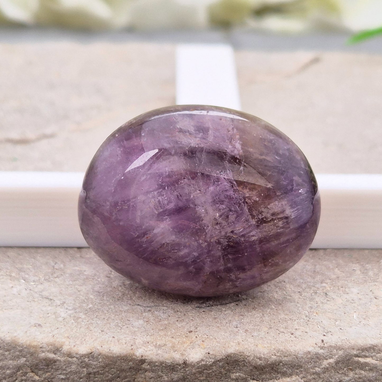 Ametrine polished palm stone with soft purple and golden tones. A natural blend of Amethyst and Citrine with a balanced, easy feel. 