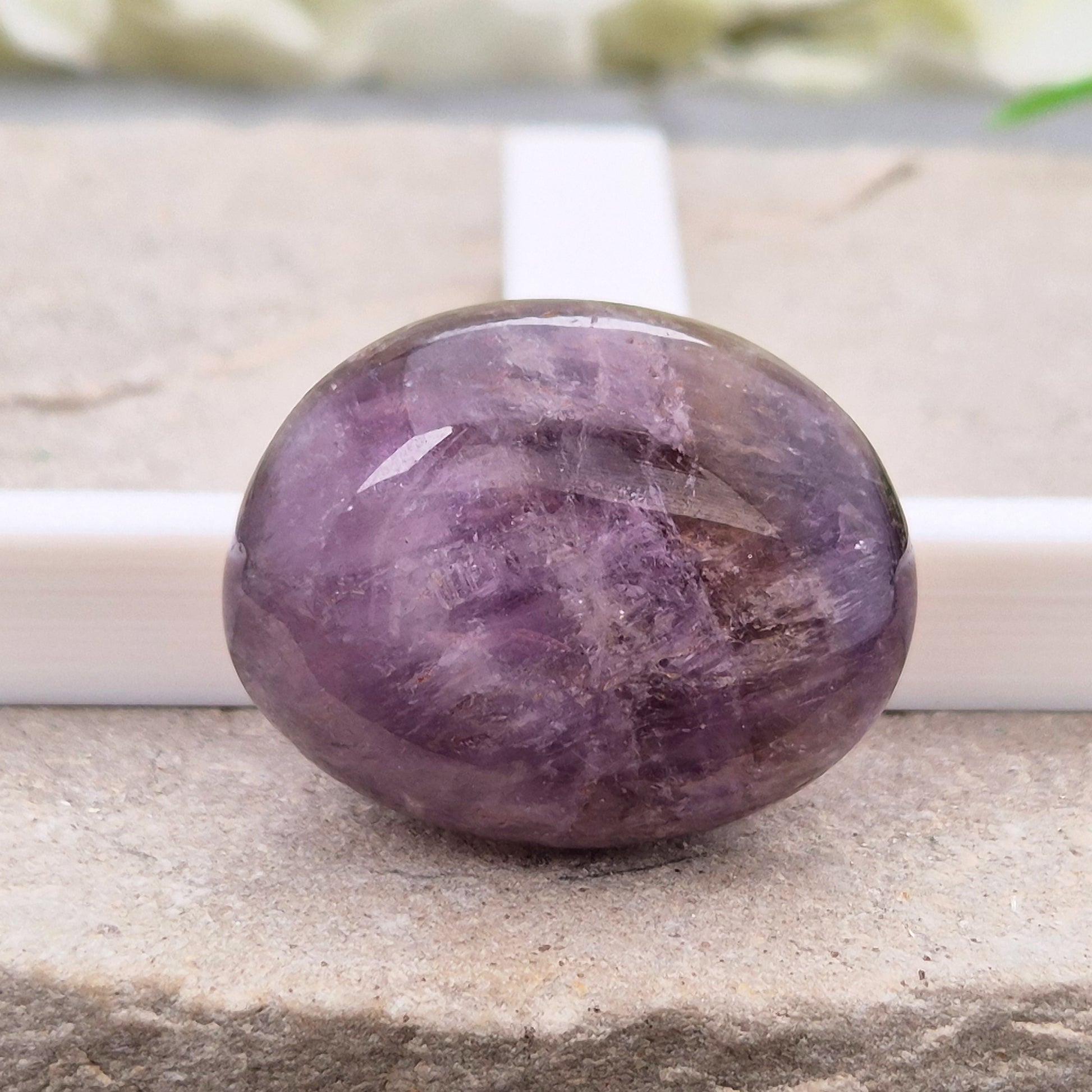 Ametrine polished palm stone with soft purple and golden tones. A natural blend of Amethyst and Citrine with a balanced, easy feel. 