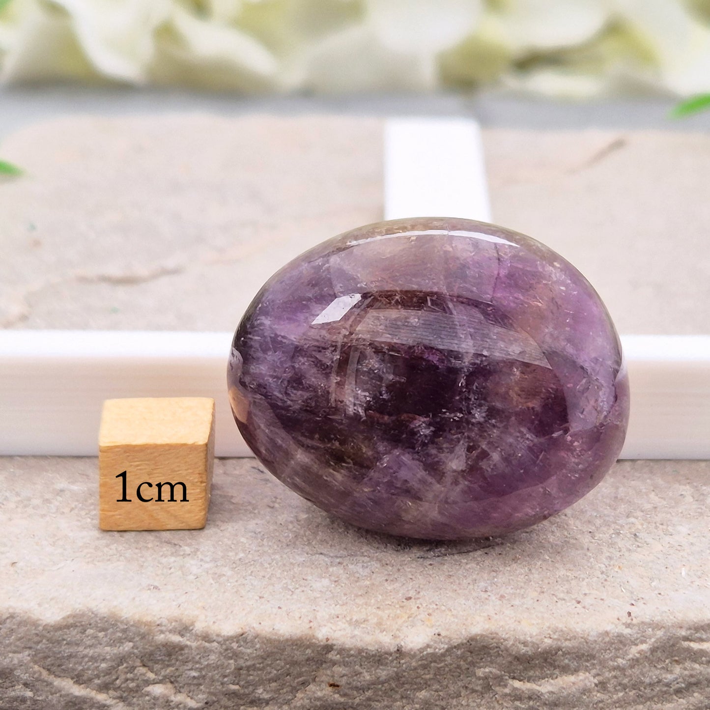 Ametrine polished palm stone with soft purple and golden tones. A natural blend of Amethyst and Citrine with a balanced, easy feel. 
