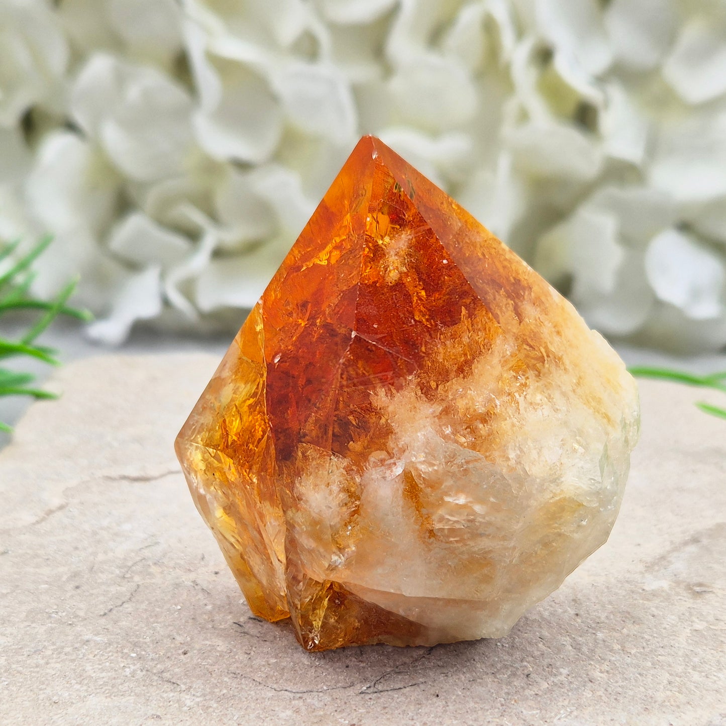 Citrine crystal standing point from Brazil with a polished tip and natural sides. Associated with confidence, motivation, positivity, and personal growth.