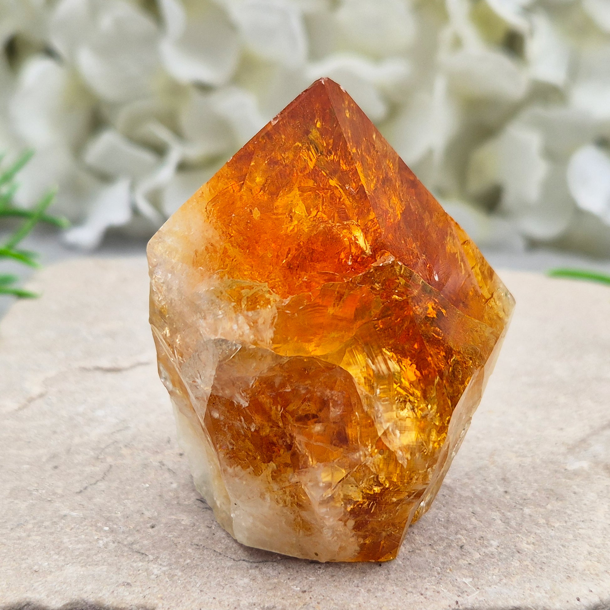 Citrine crystal standing point from Brazil with a polished tip and natural sides. Associated with confidence, motivation, positivity, and personal growth.