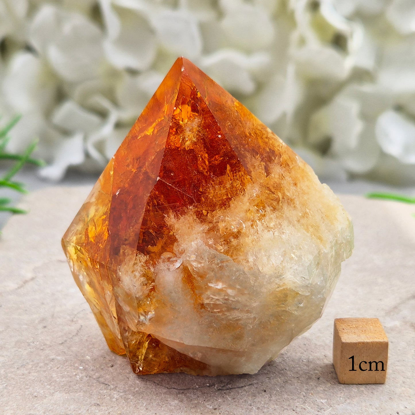Citrine crystal standing point from Brazil with a polished tip and natural sides. Associated with confidence, motivation, positivity, and personal growth.