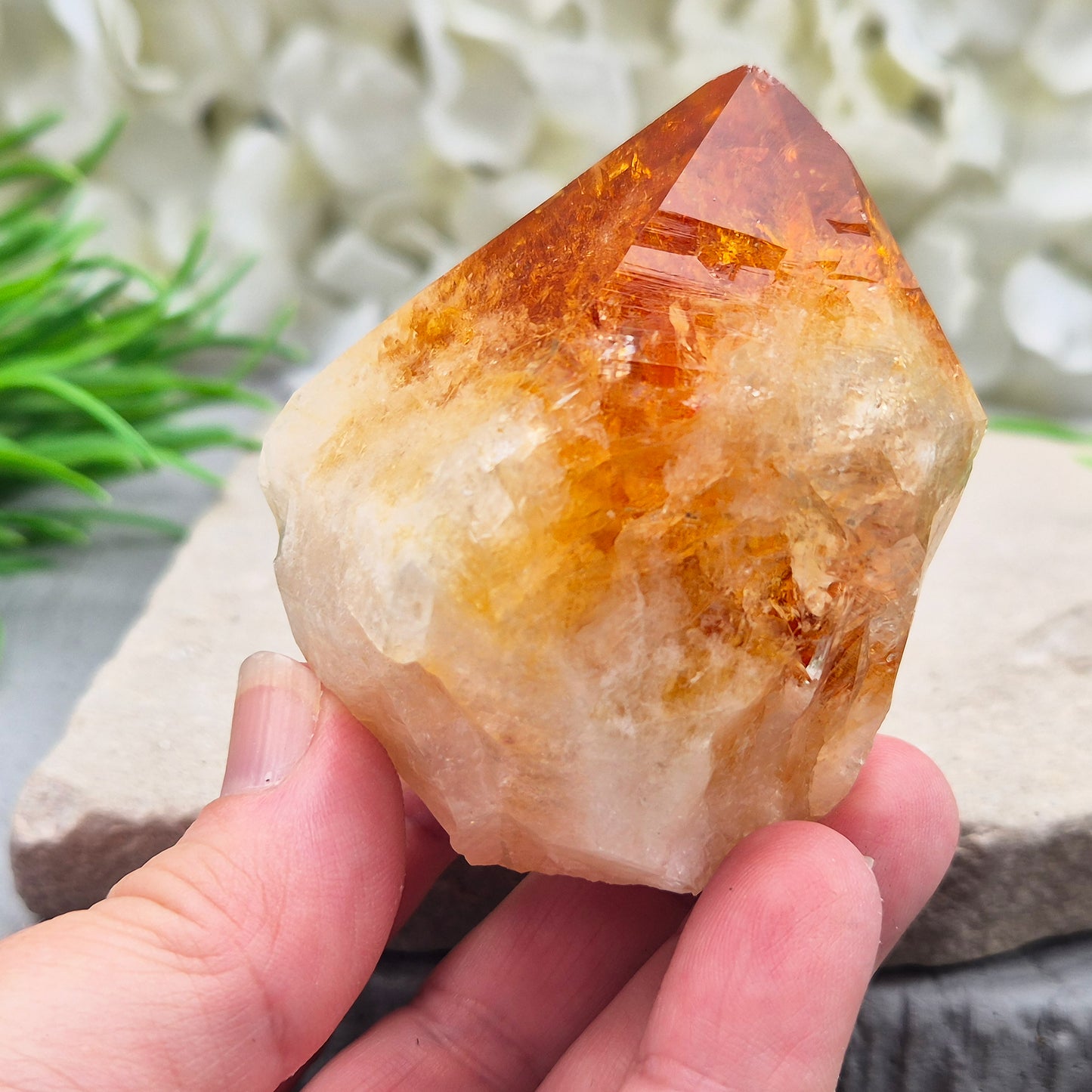 Citrine crystal standing point from Brazil with a polished tip and natural sides. Associated with confidence, motivation, positivity, and personal growth.
