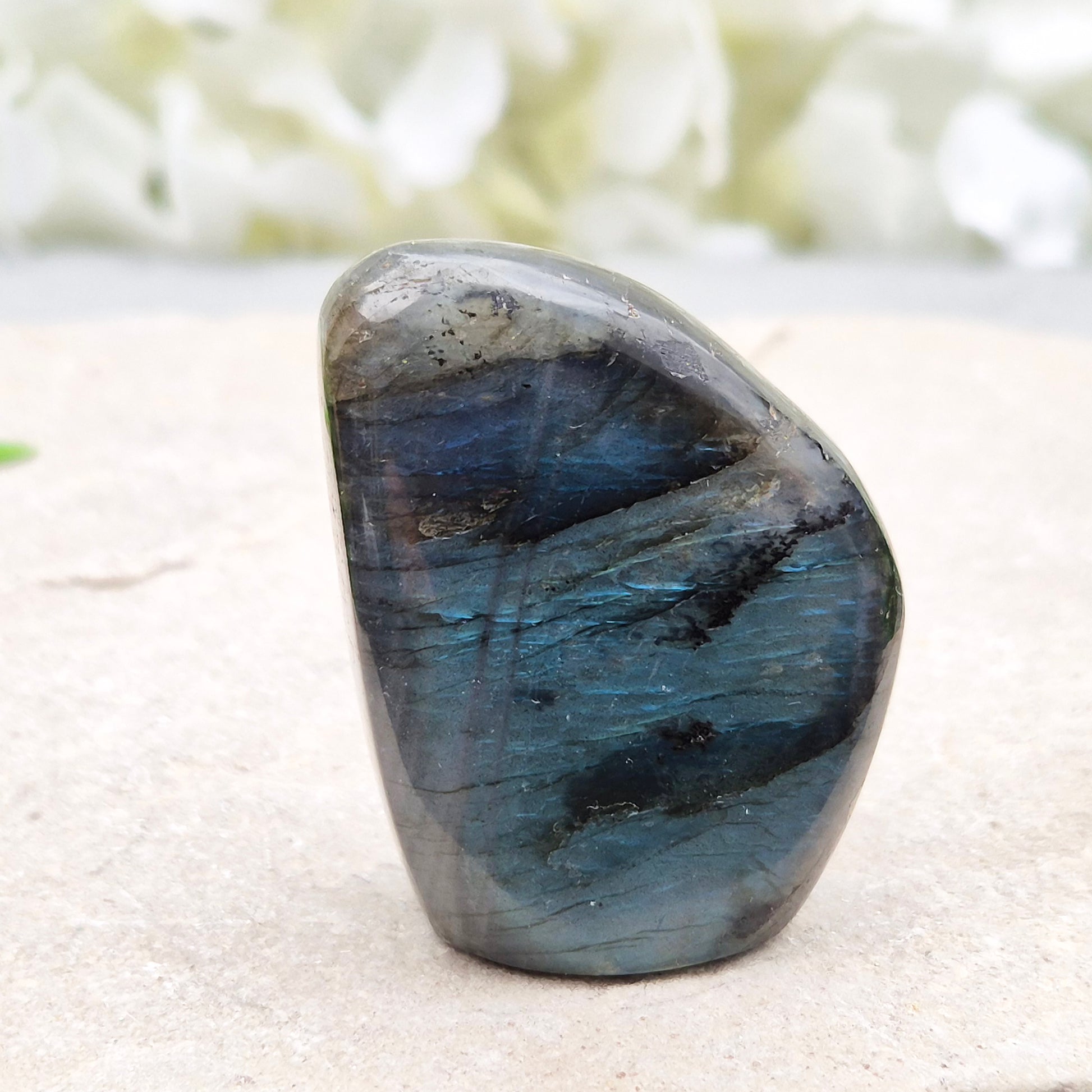 Labradorite freeform crystal with flashes of colour. Supports intuition, focus, and spiritual balance. Perfect for display or energy work.