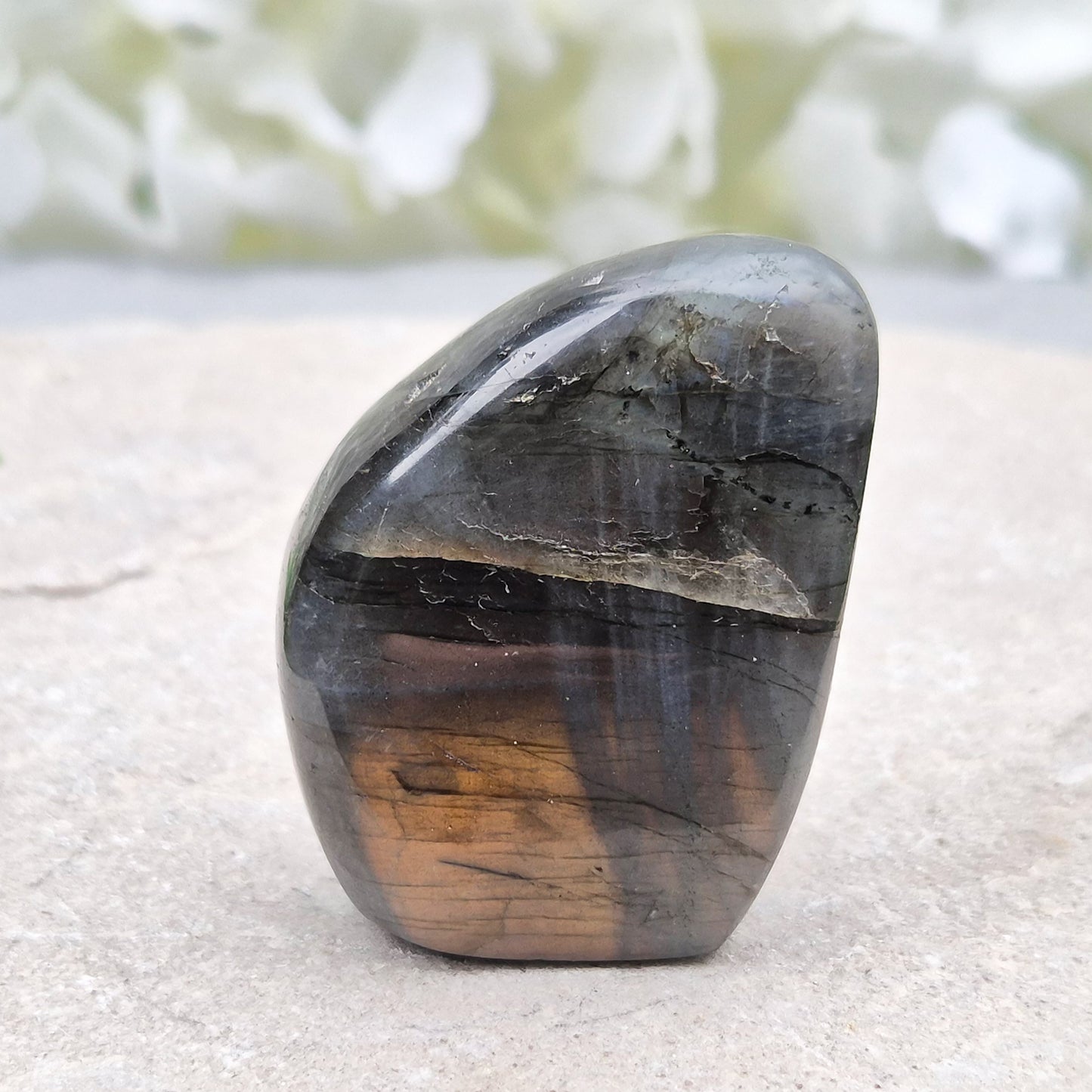 Labradorite freeform crystal with flashes of colour. Supports intuition, focus, and spiritual balance. Perfect for display or energy work.