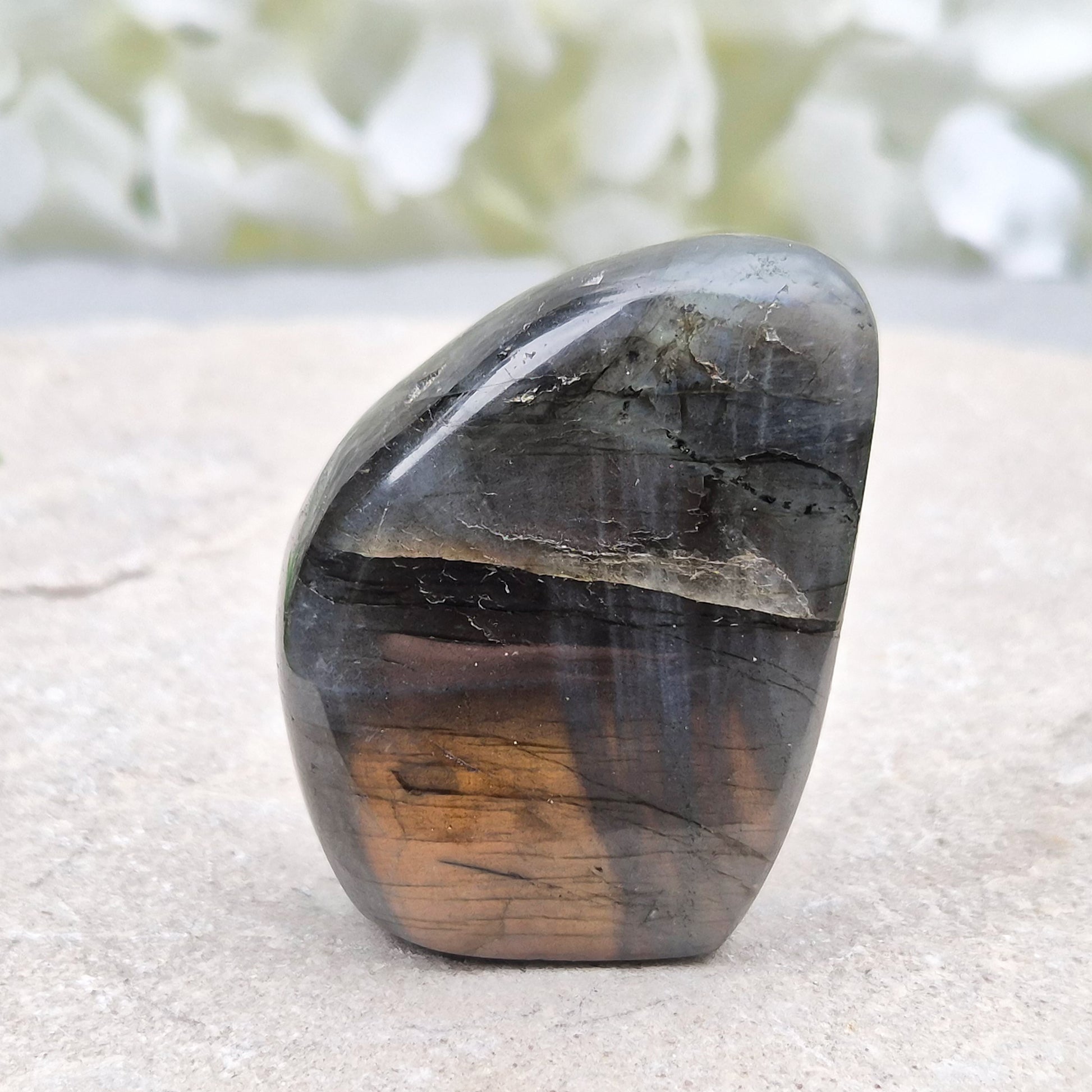 Labradorite freeform crystal with flashes of colour. Supports intuition, focus, and spiritual balance. Perfect for display or energy work.