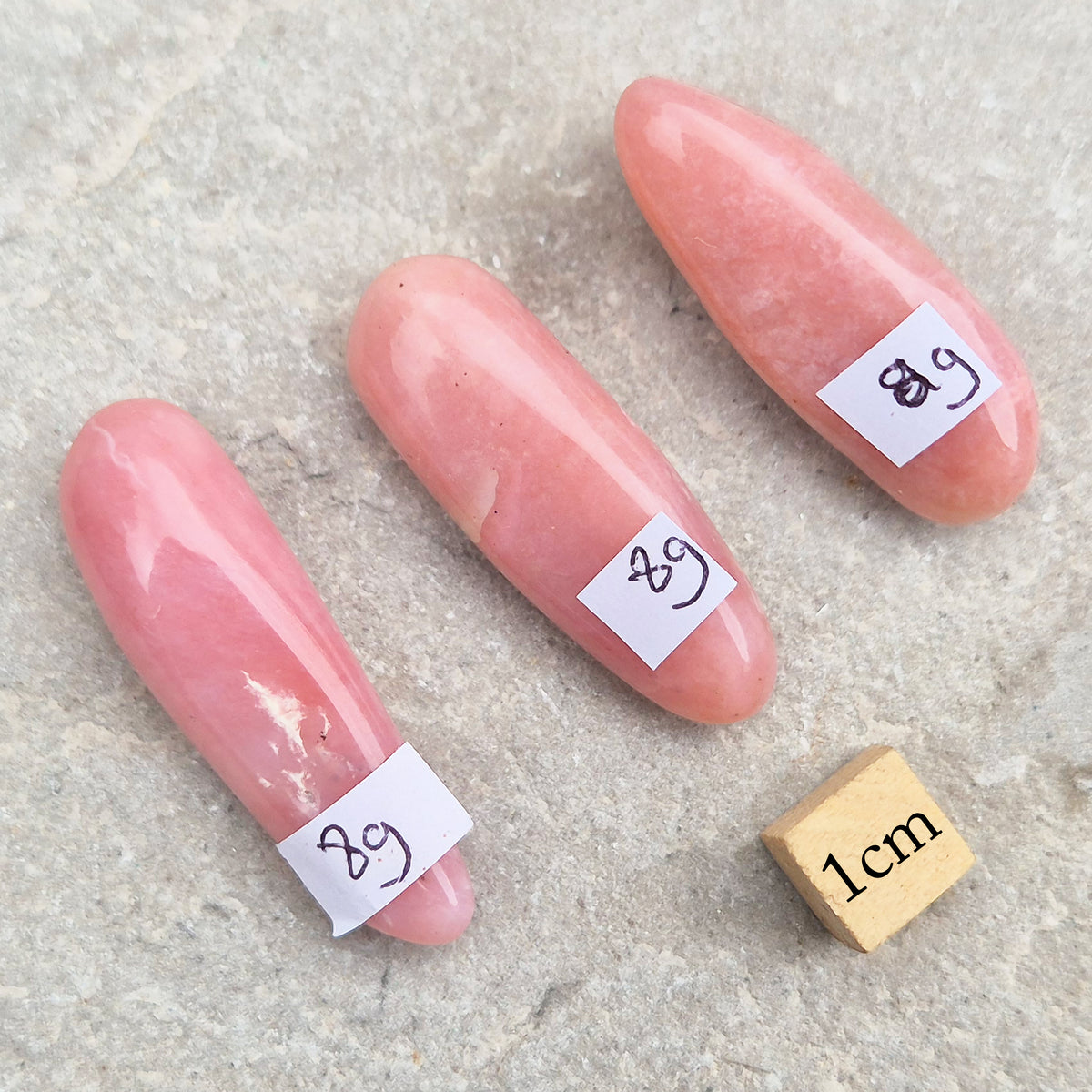 Pink Opal polished wand in soft pink to salmon tones. Linked to the heart chakra, known as a gentle, supportive stone during difficult or emotional times.
