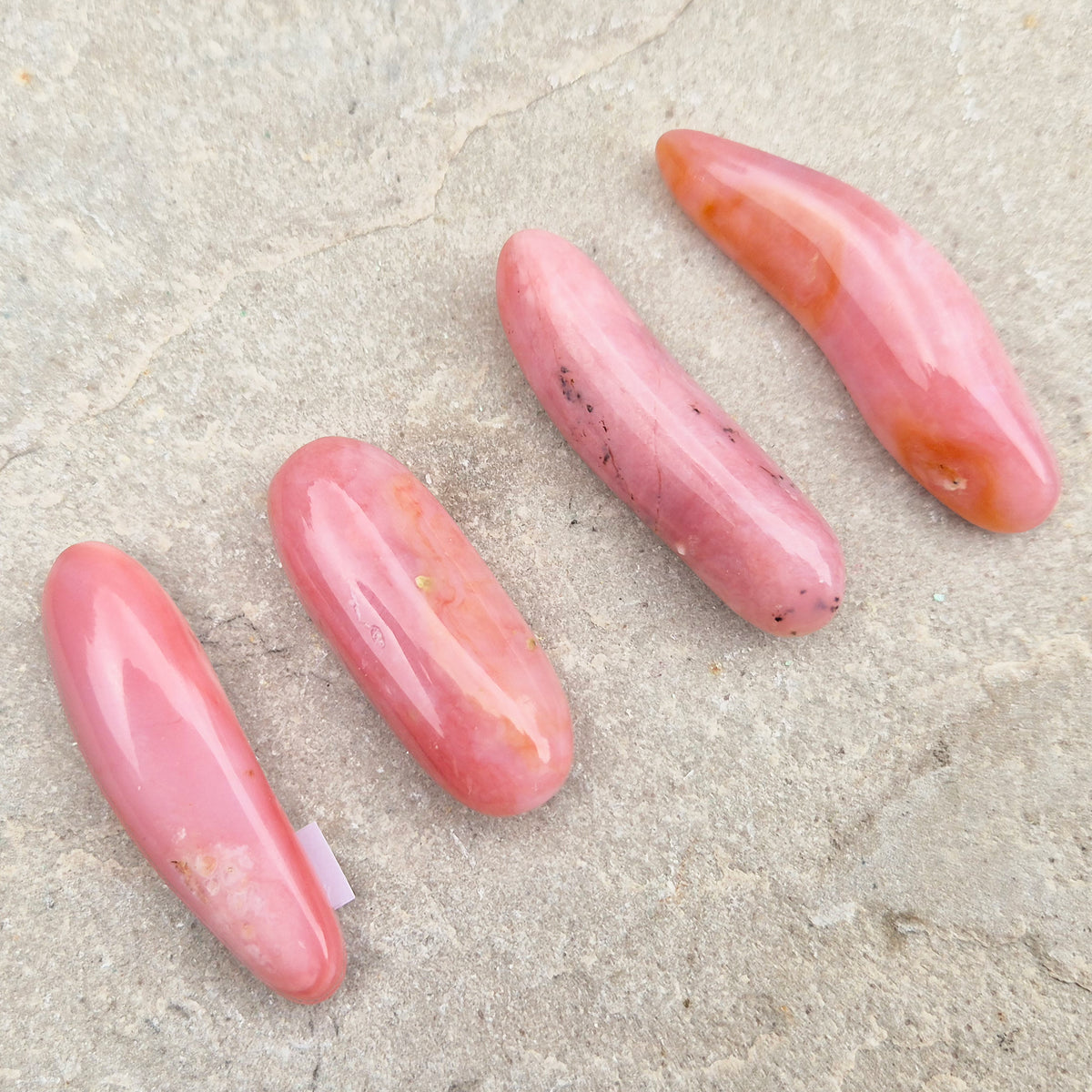 Pink Opal polished wand in soft pink to salmon tones. Linked to the heart chakra, known as a gentle, supportive stone during difficult or emotional times.