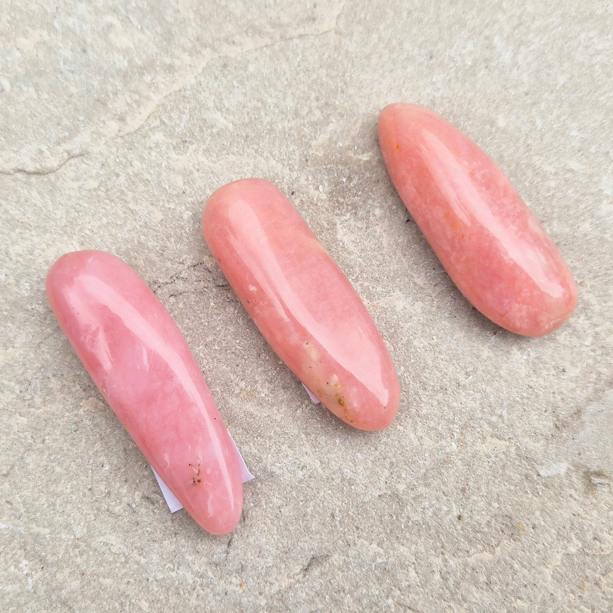 Pink Opal polished wand in soft pink to salmon tones. Linked to the heart chakra, known as a gentle, supportive stone during difficult or emotional times.