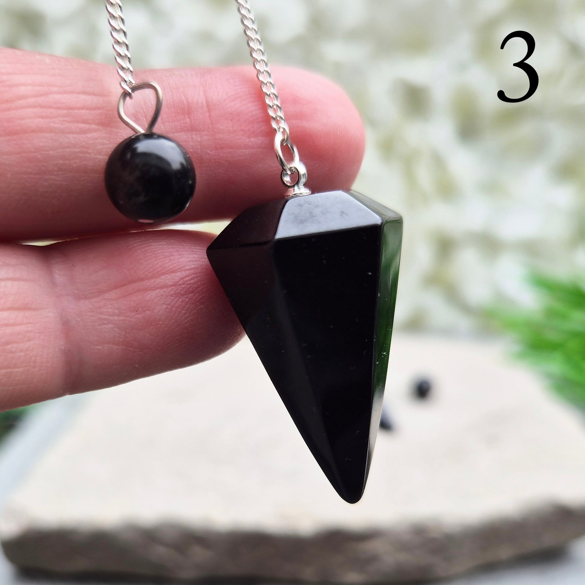 Natural Black Tourmaline crystal pendulum for dowsing, divination, and spiritual work. A grounding stone linked with protection and balance