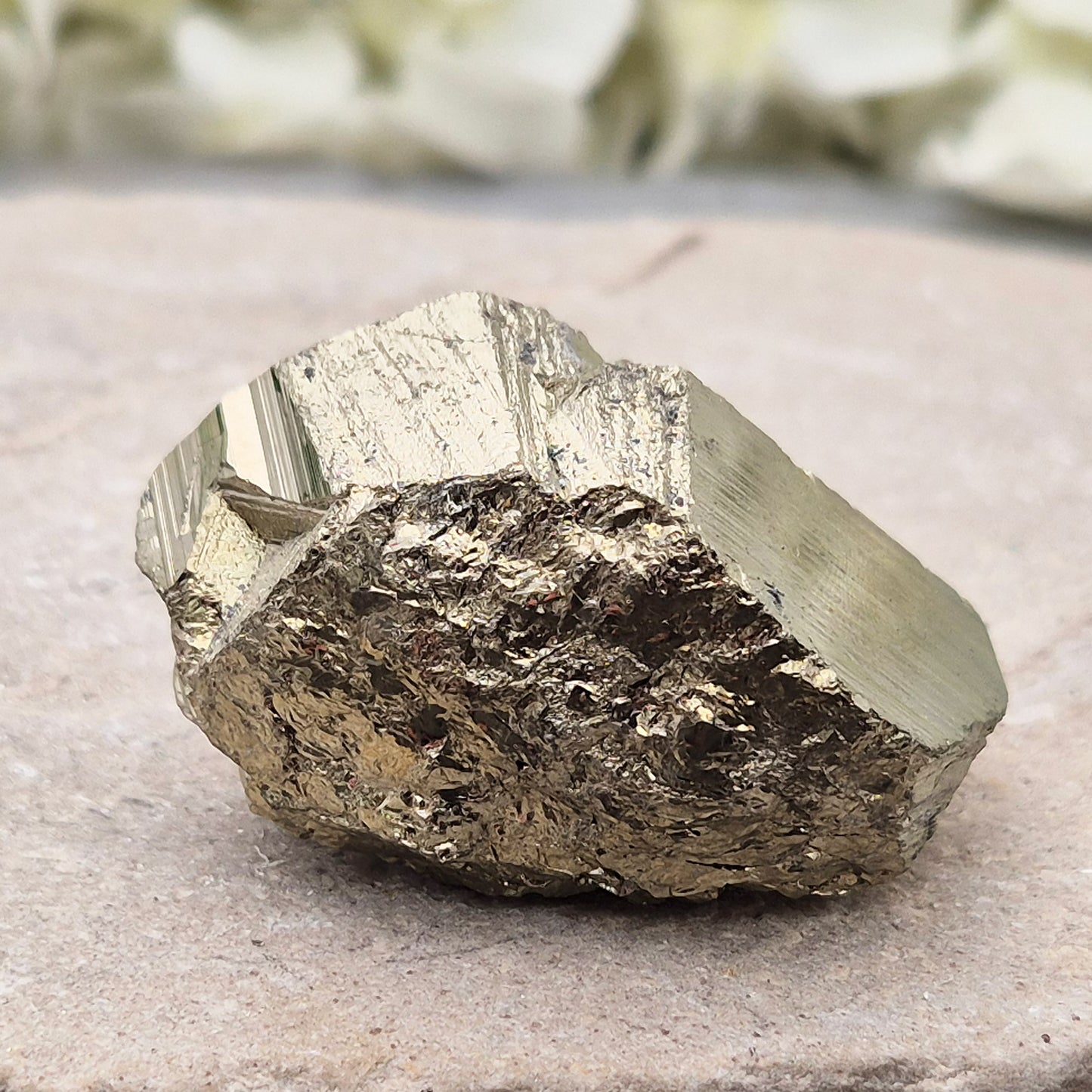 Pyrite specimen with striated face and bright metallic shine. Sparkling smooth and natural texture, ideal for display, grounding energy, or crystal collections.