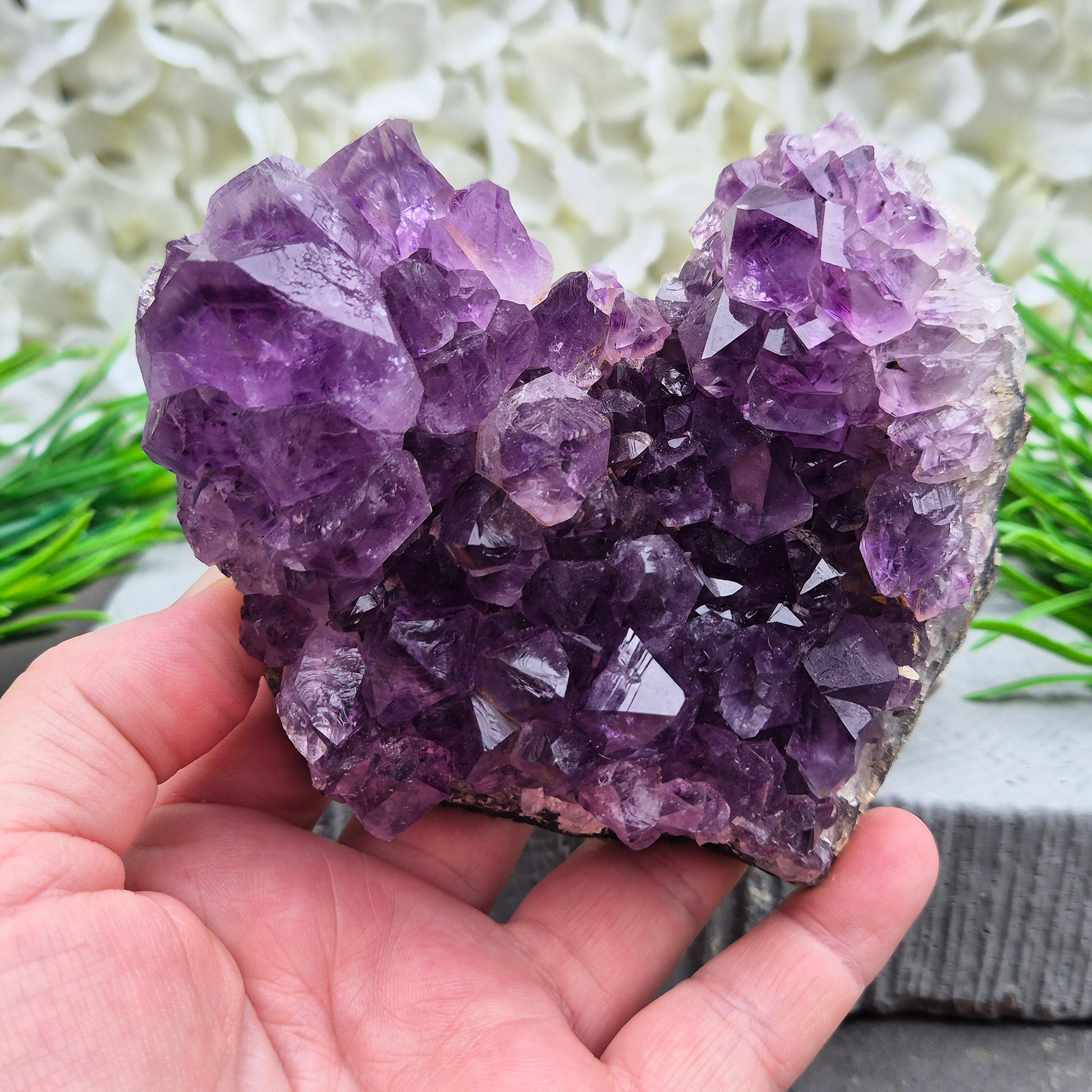 A grade Brazilian Amethyst cluster with deep purple points. A calming crystal for peaceful home spaces, bedrooms, and thoughtful crystal gifts.