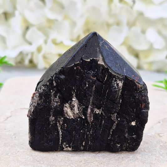Hand-picked A grade Black Tourmaline standing point from a UK independent shop. Known for grounding energy — a striking, one-of-a-kind piece.