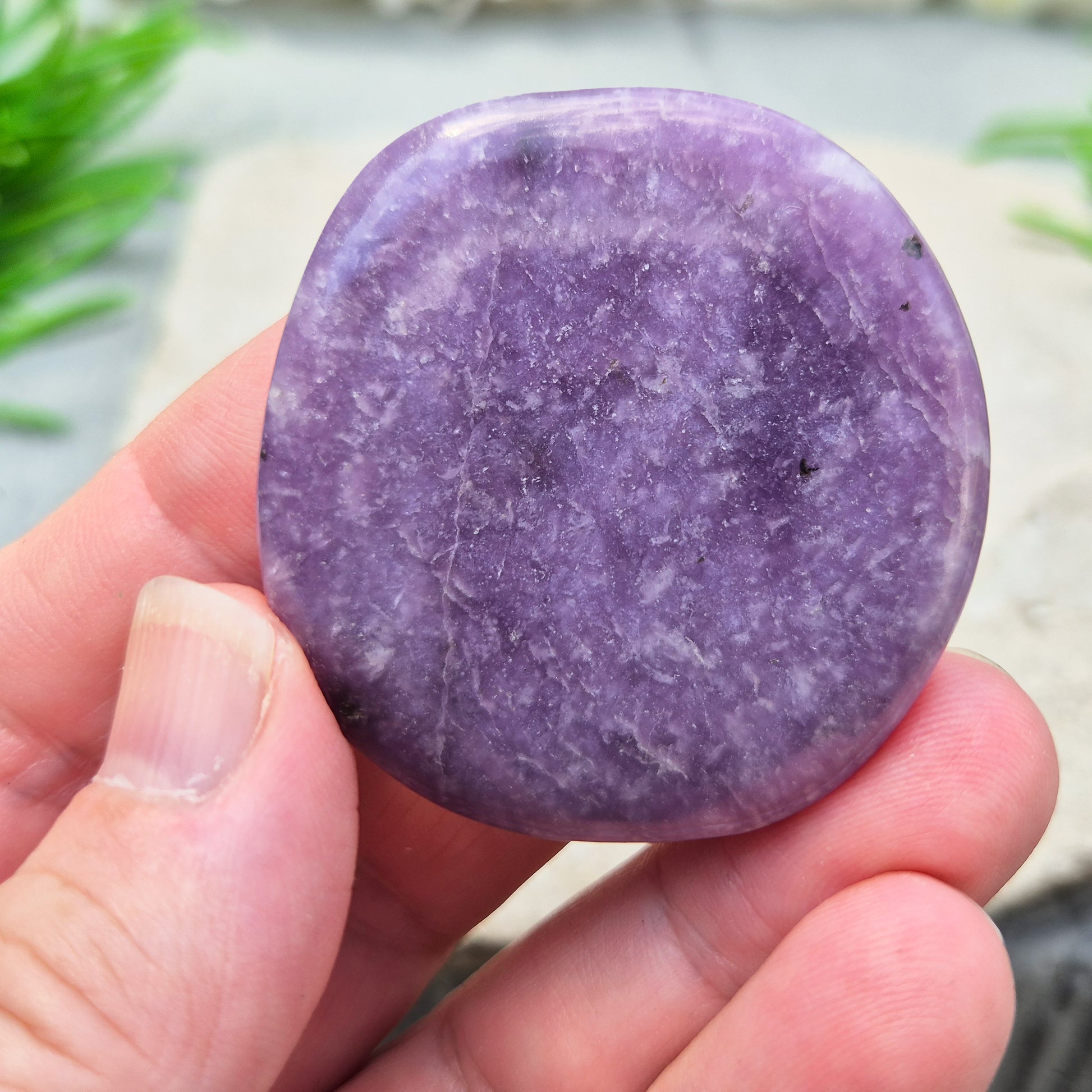 Lepidolite palm stone with calming, balancing energy. Known for easing stress and emotional overwhelm. Smooth, soothing, and ideal for daily support.
