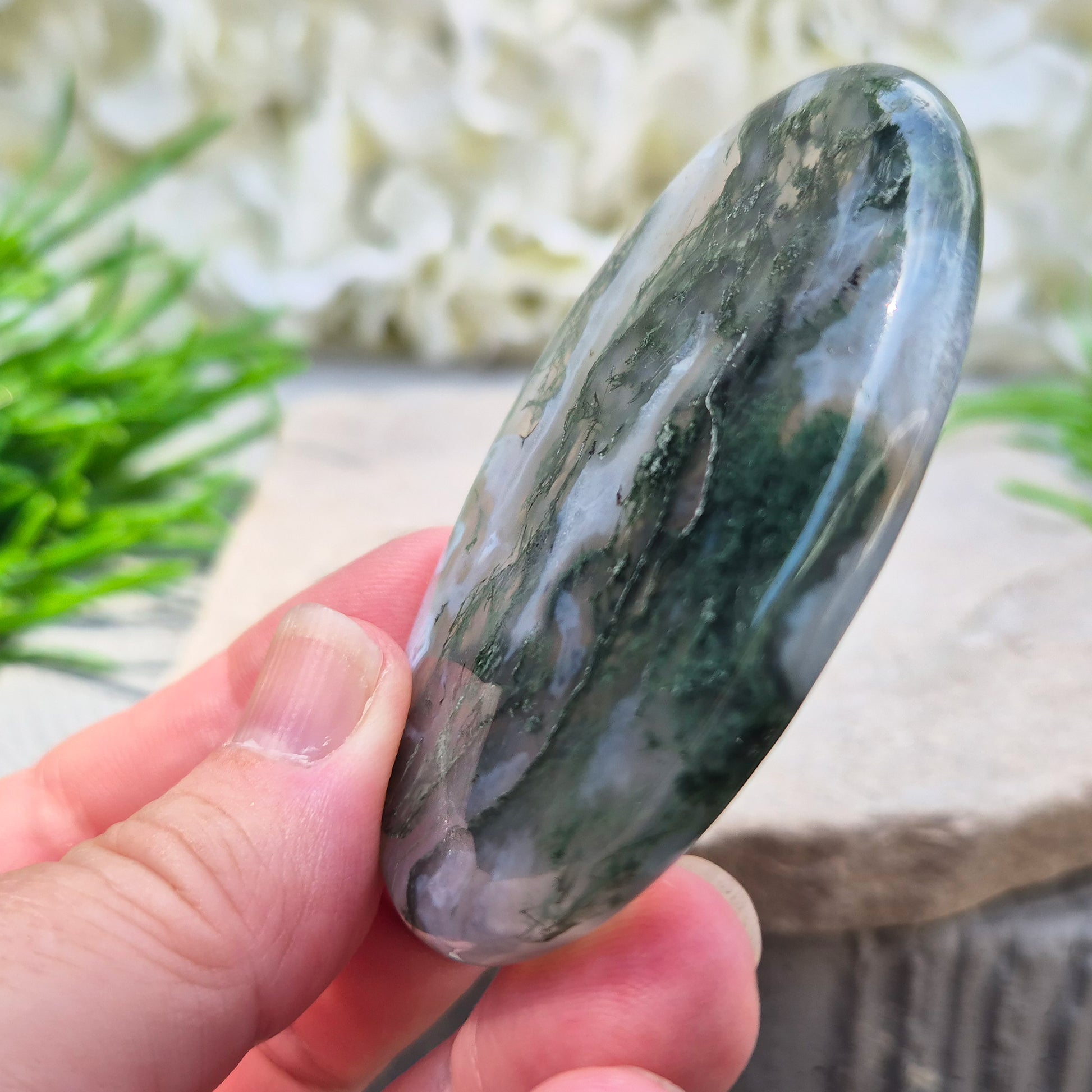 Polished Moss Agate palm stone. Known as a stone of nature, grounding and growth, it supports balance, stability and a calm, centred mind.