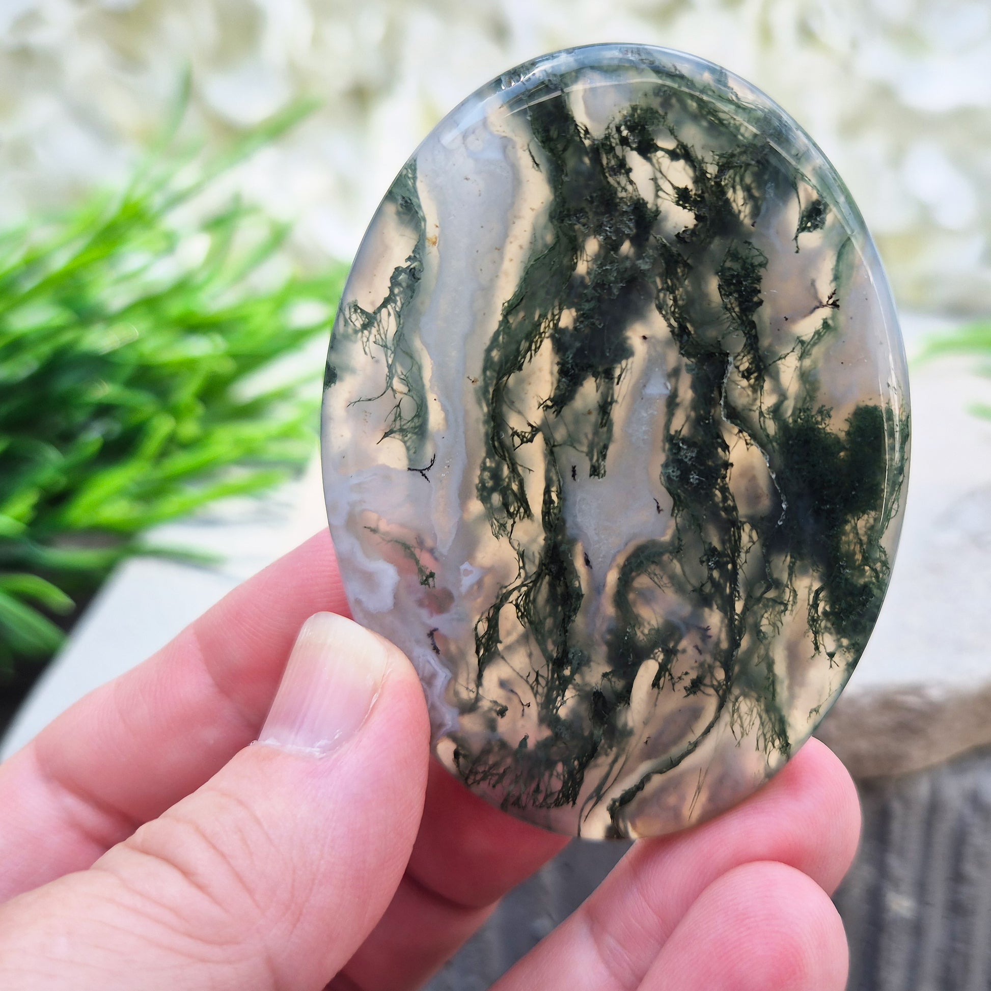 Polished Moss Agate palm stone. Known as a stone of nature, grounding and growth, it supports balance, stability and a calm, centred mind.