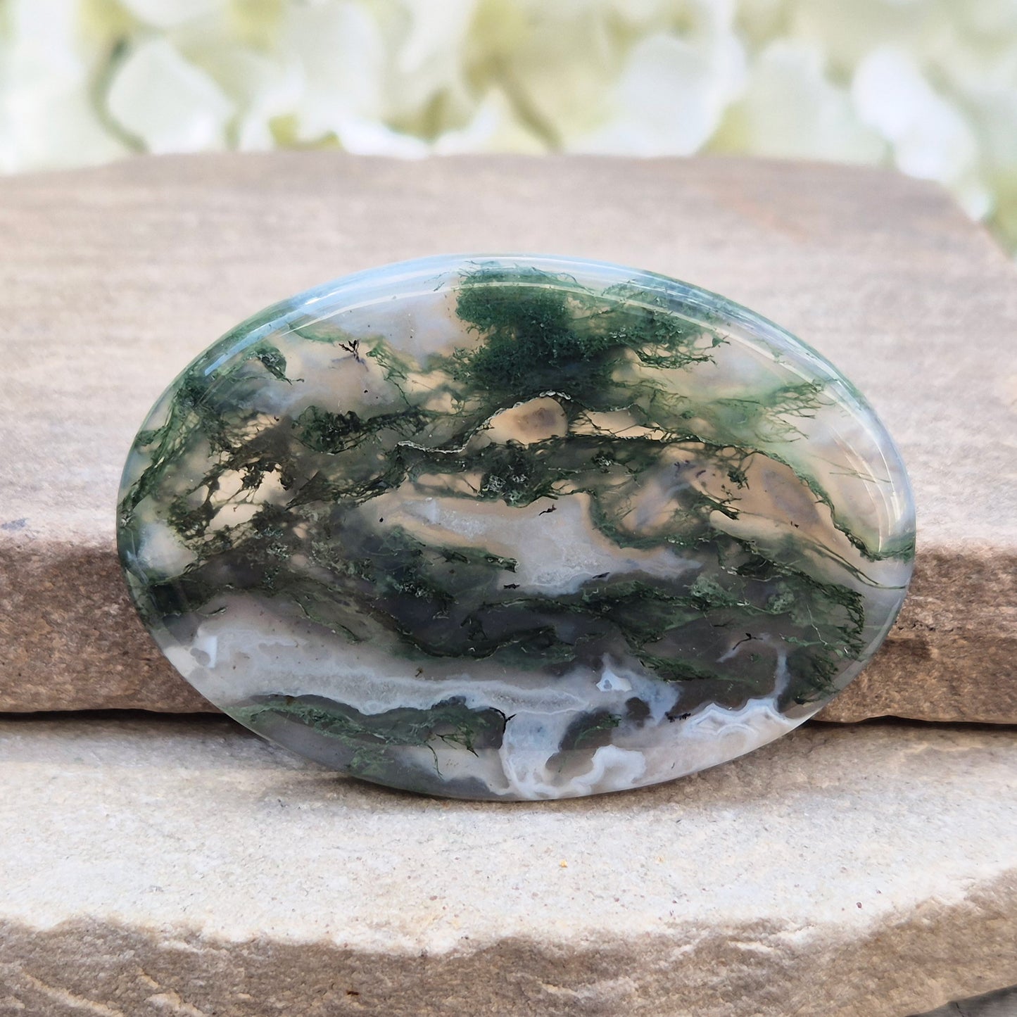 Polished Moss Agate palm stone. Known as a stone of nature, grounding and growth, it supports balance, stability and a calm, centred mind.
