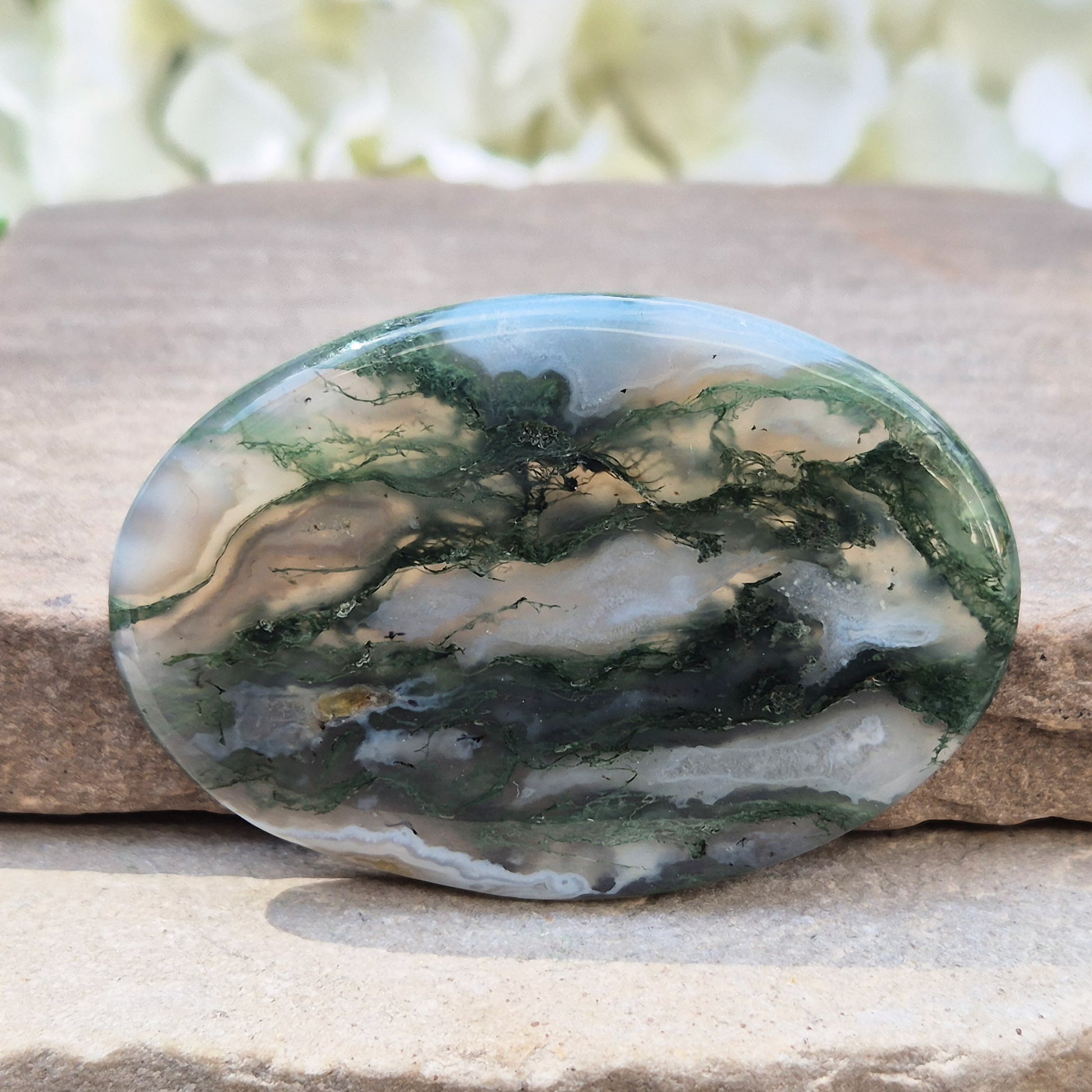 Polished Moss Agate palm stone. Known as a stone of nature, grounding and growth, it supports balance, stability and a calm, centred mind.