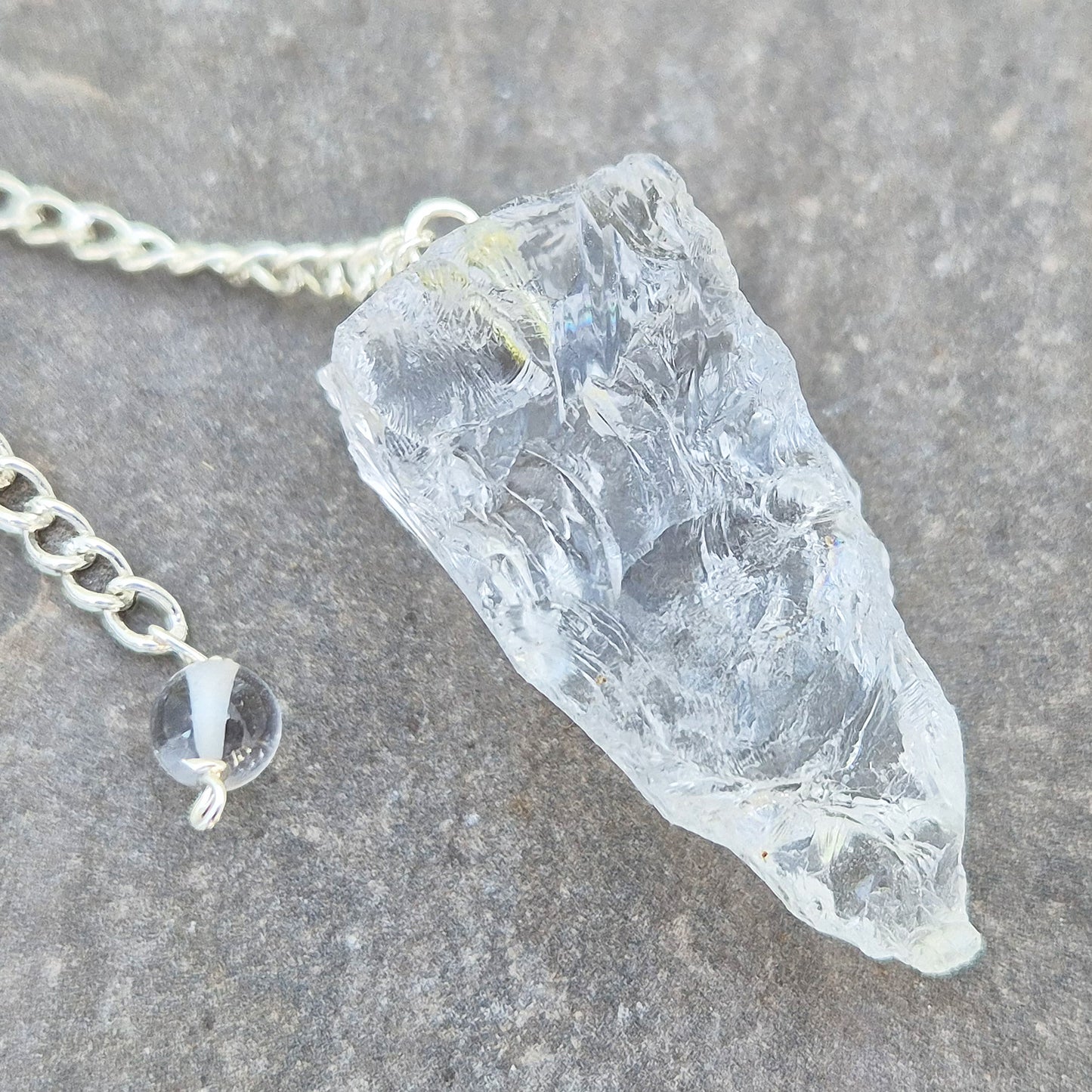 Rock Quartz crystal pendulum for dowsing, energy work, meditation, and connecting with your intuition. A beautiful tool to support focus and awareness.