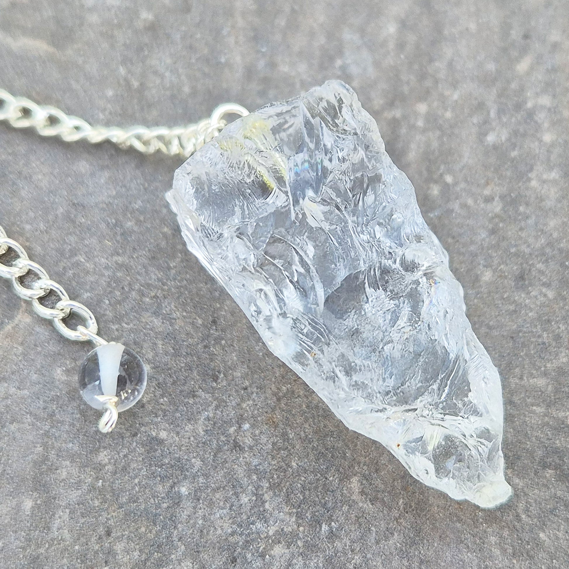Rock Quartz crystal pendulum for dowsing, energy work, meditation, and connecting with your intuition. A beautiful tool to support focus and awareness.
