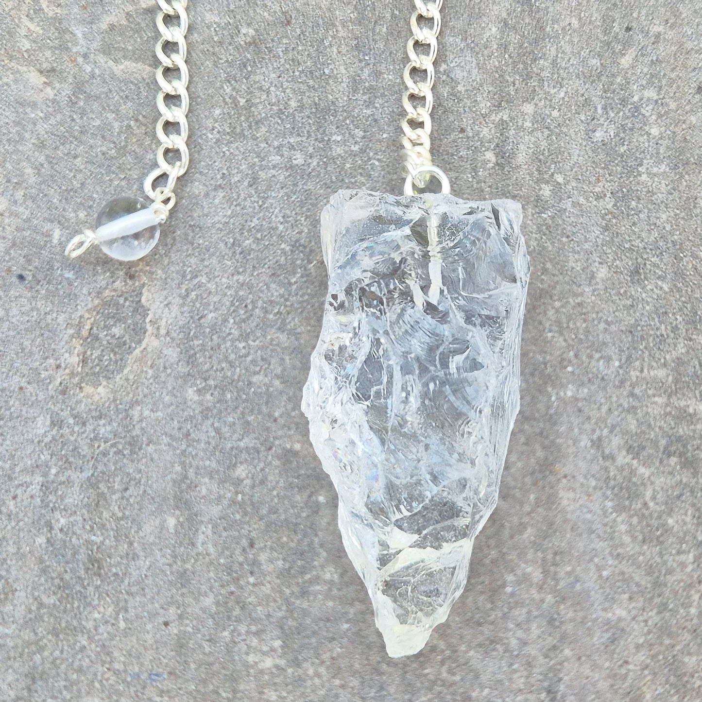 Rock Quartz crystal pendulum for dowsing, energy work, meditation, and connecting with your intuition. A beautiful tool to support focus and awareness.