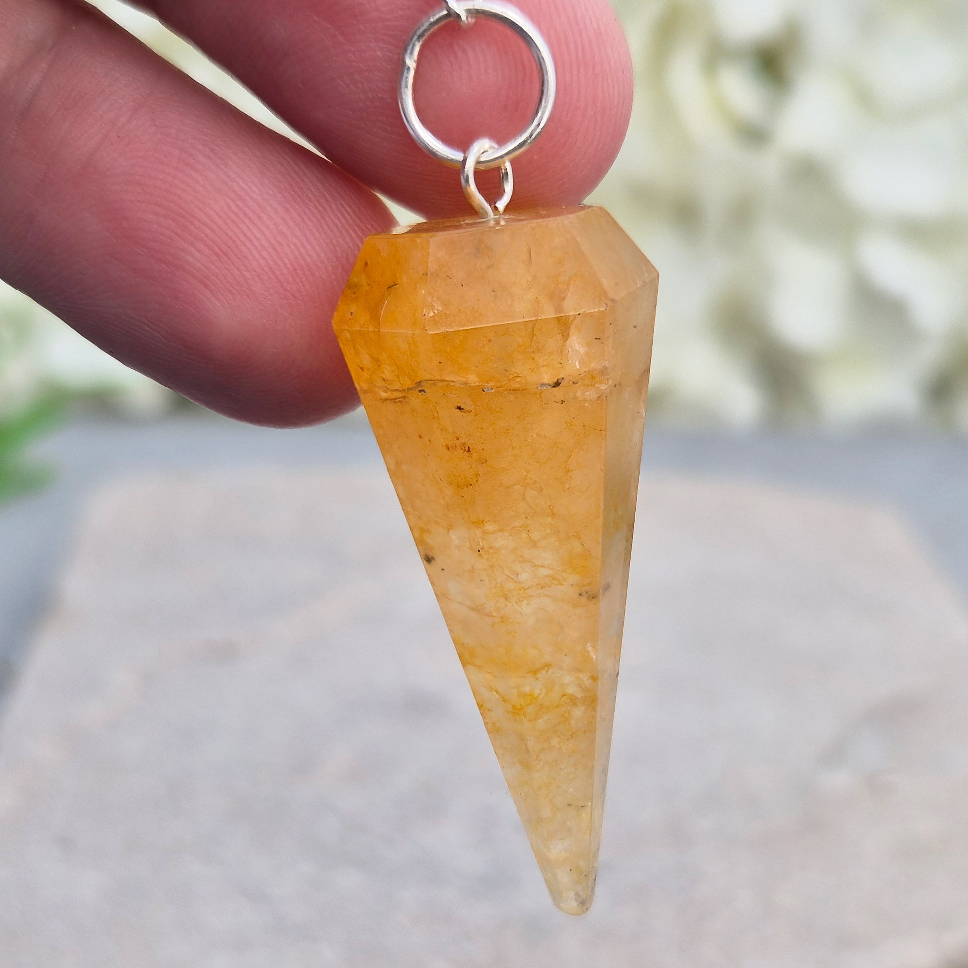 Golden Healer Quartz pendulum for dowsing and energy work. Supports clarity, balance, healing, and connection to higher guidance. 