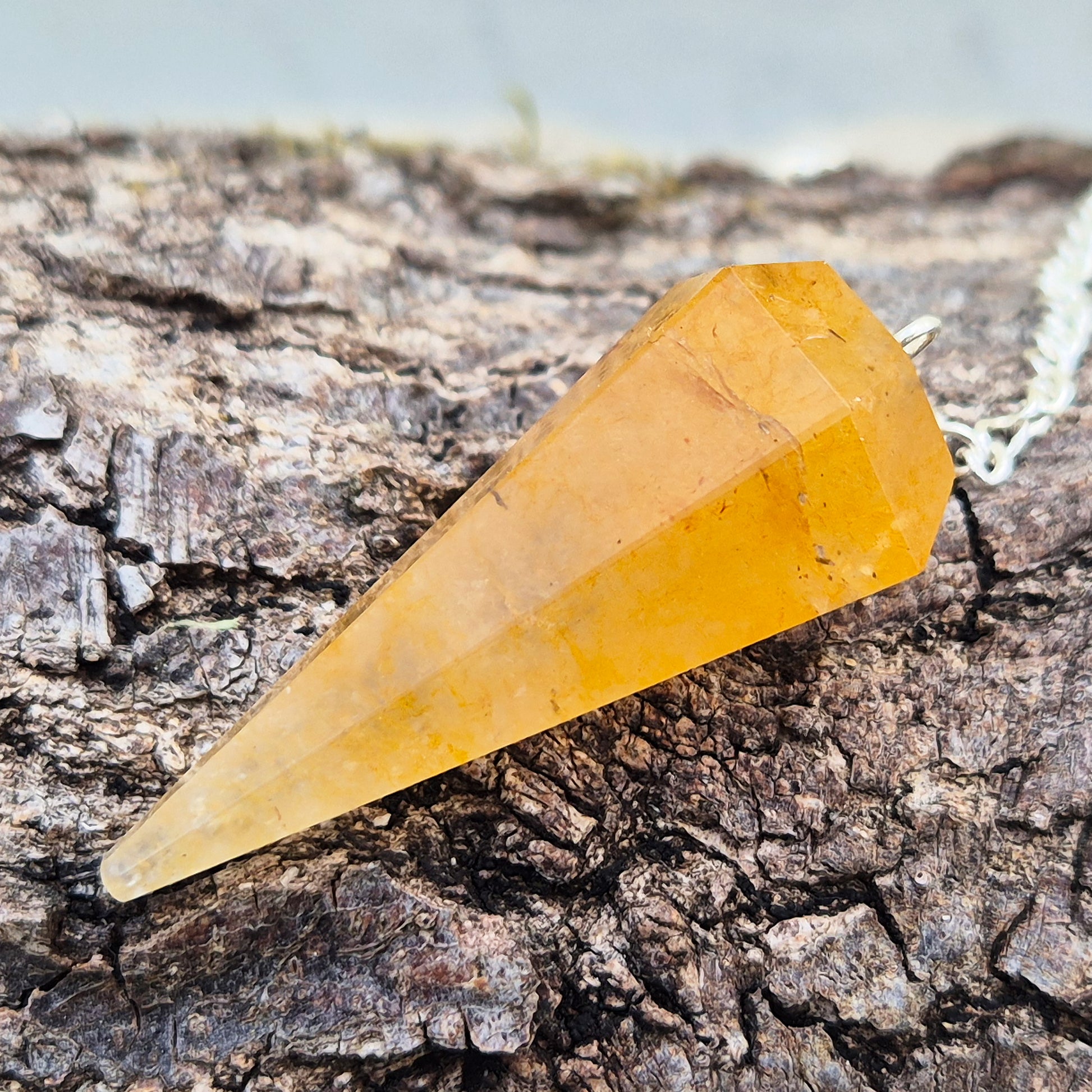 Golden Healer Quartz pendulum for dowsing and energy work. Supports clarity, balance, healing, and connection to higher guidance. 