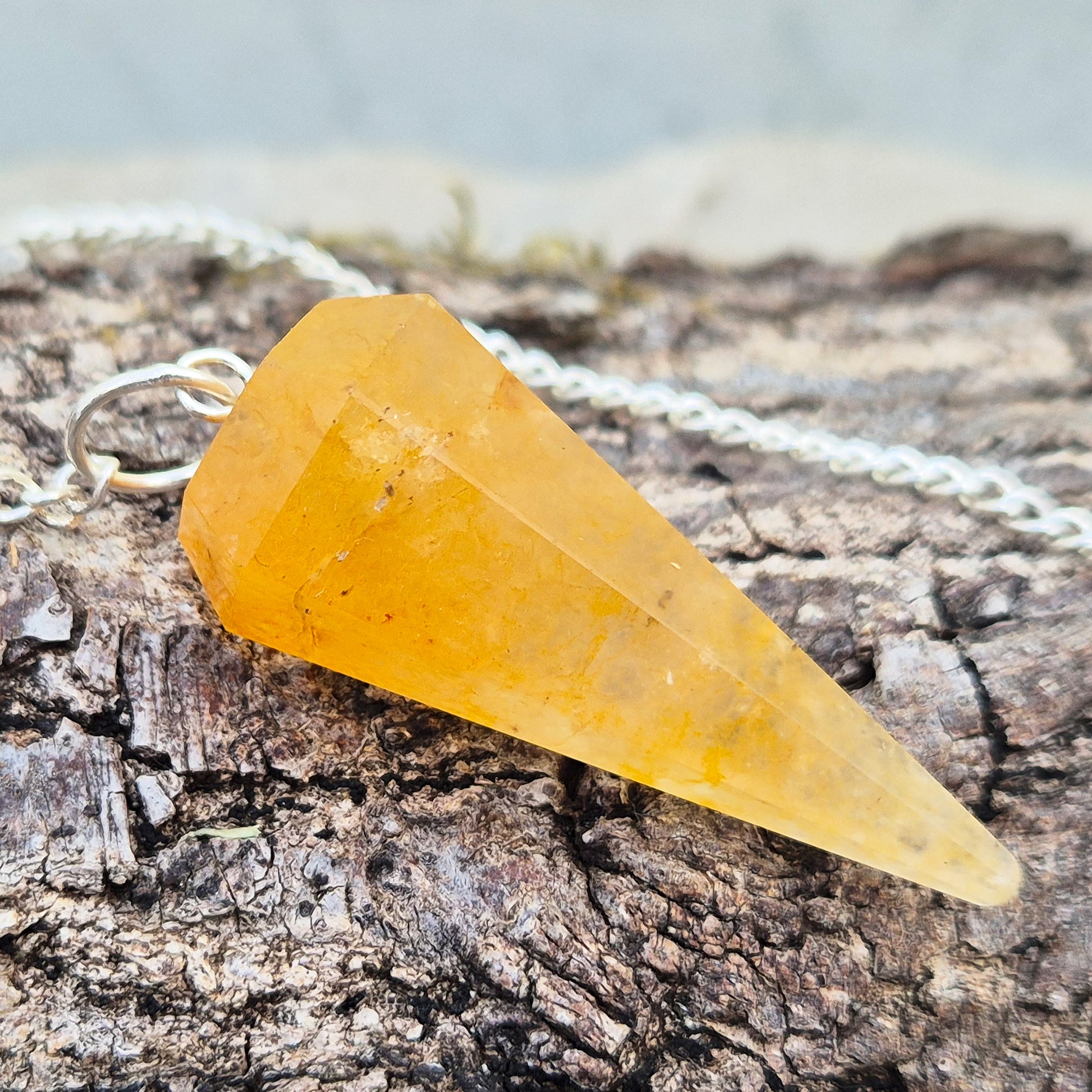 Golden Healer Quartz pendulum for dowsing and energy work. Supports clarity, balance, healing, and connection to higher guidance. 