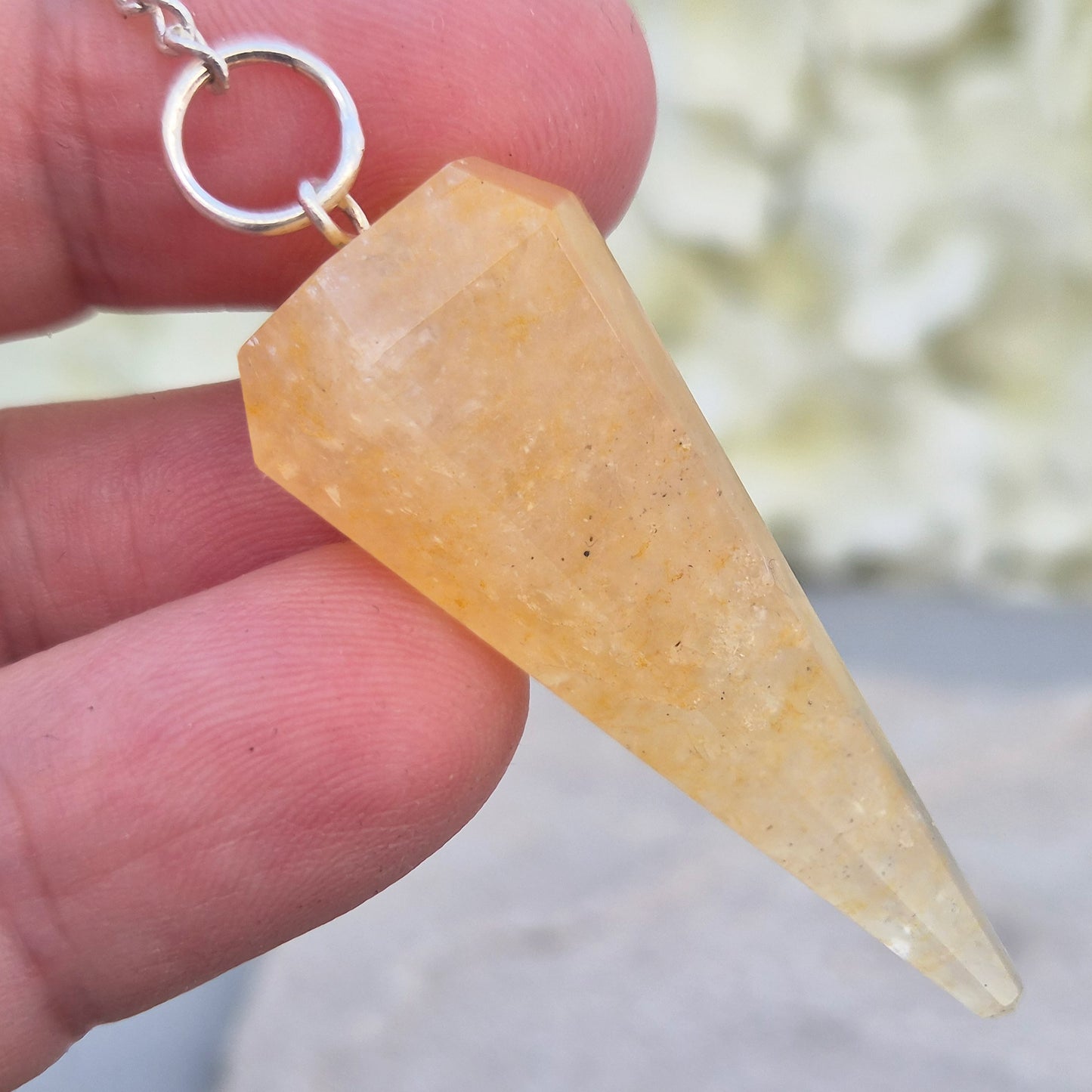 Golden Healer Quartz pendulum for energy work, dowsing, and intuitive guidance. Connects to gentle healing, balance, and spiritual growth.