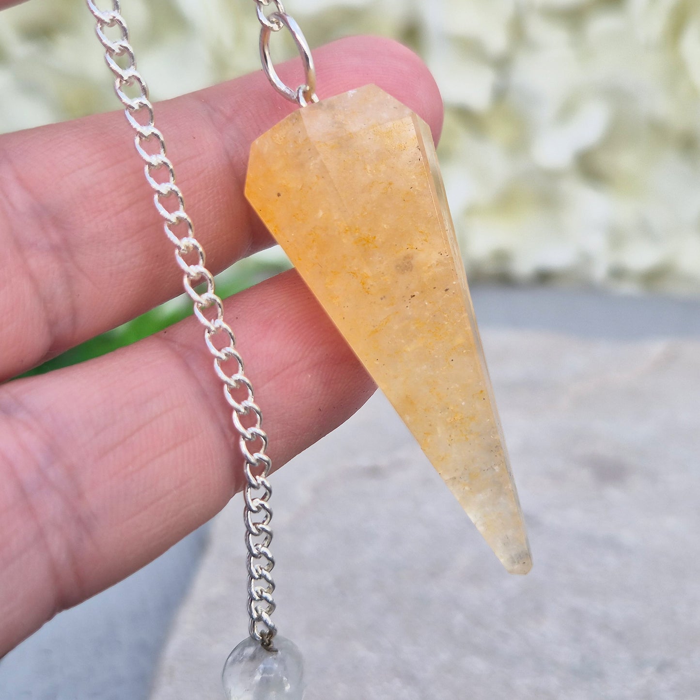 Golden Healer Quartz pendulum for energy work, dowsing, and intuitive guidance. Connects to gentle healing, balance, and spiritual growth.
