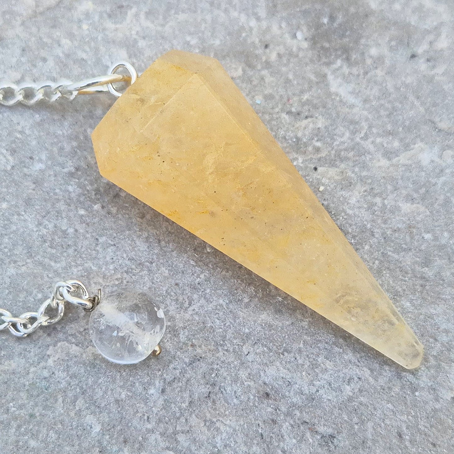 Golden Healer Quartz pendulum for energy work, dowsing, and intuitive guidance. Connects to gentle healing, balance, and spiritual growth.
