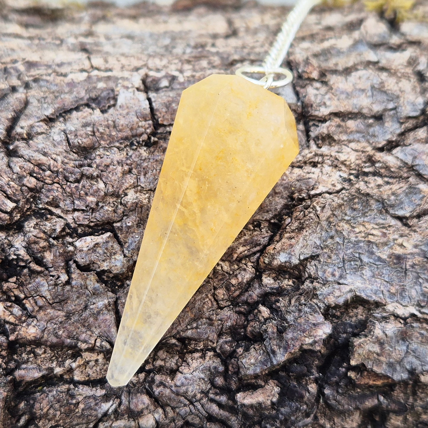 Golden Healer Quartz pendulum for energy work, dowsing, and intuitive guidance. Connects to gentle healing, balance, and spiritual growth.